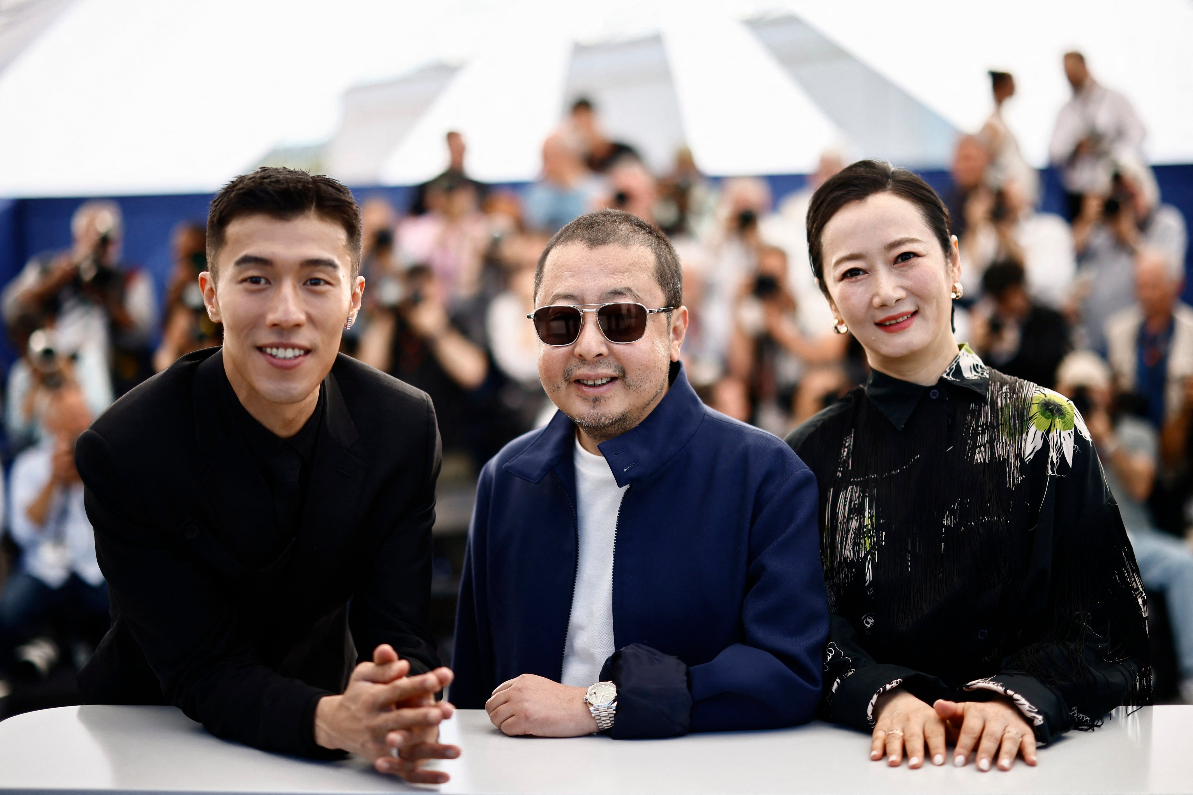 Chinese auteur Jia Zhangke and cast members of his latest film Caught by the Tides, Zhao Tao and Zhou You at the 77th Cannes Film Festival in Cannes, France, on May 19. Photo: Reuters