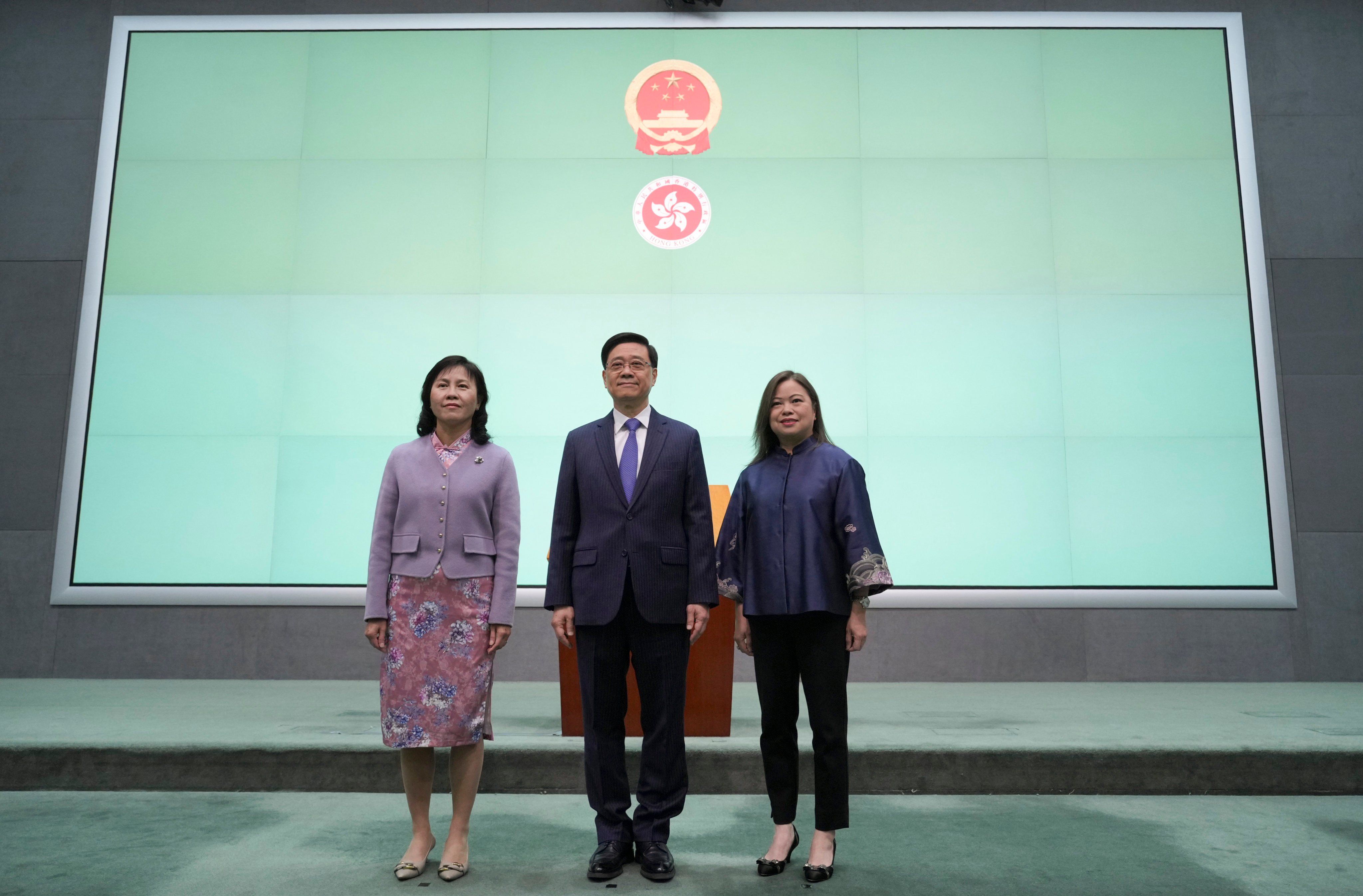 Chief Executive John Lee Ka-chiu (centre) announces the appointments of Mable Chan (left) as secretary for transport and logistics, and Rosanna Law Shuk-pui (right) as secretary for culture, sports and tourism at the government headquarters in Tamar on December 5. Photo: May Tse