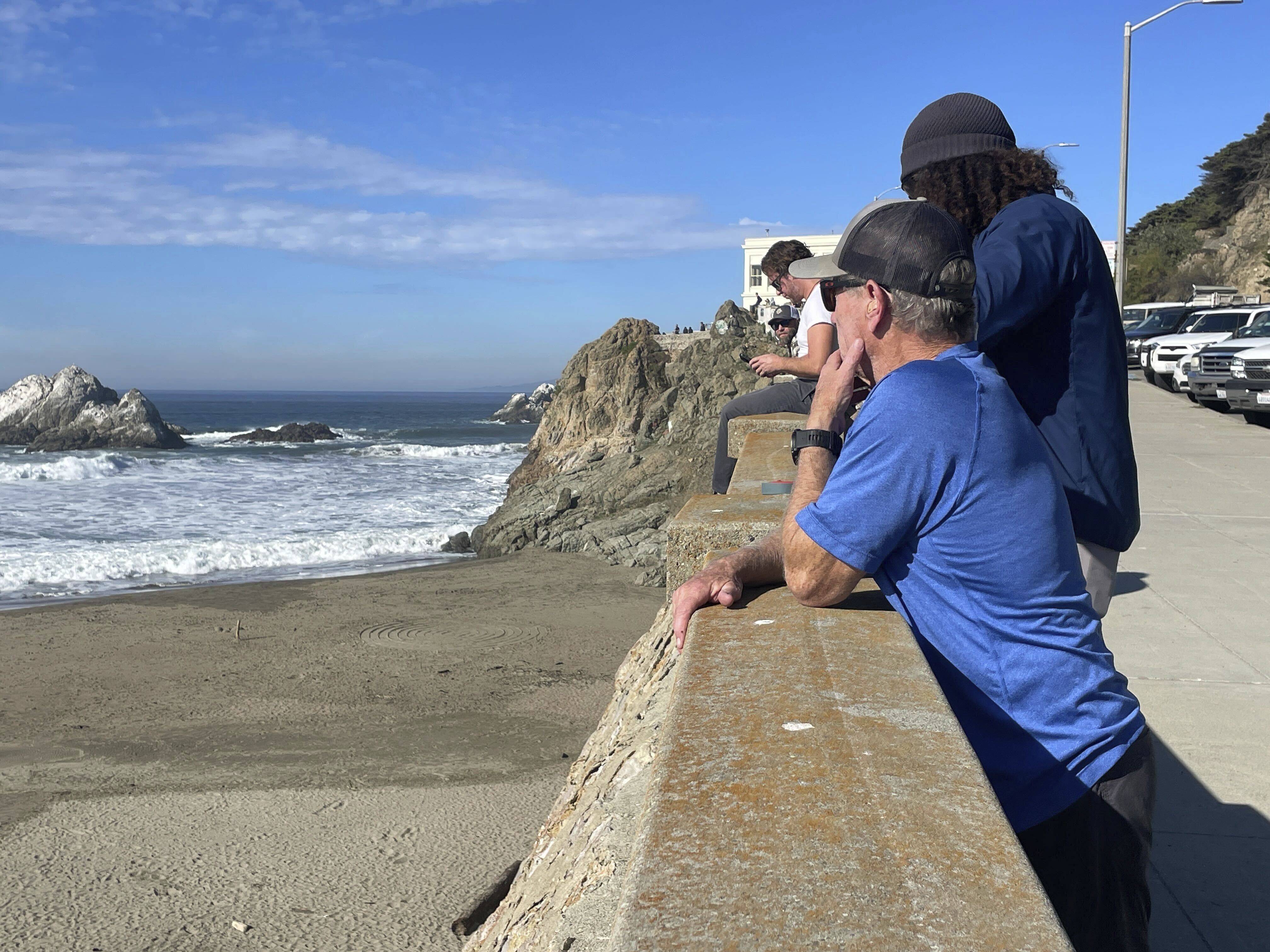 People watch the waves come in after an earthquake was felt widely across northern California, at Ocean Beach in San Francisco on Thursday. Photo: AP