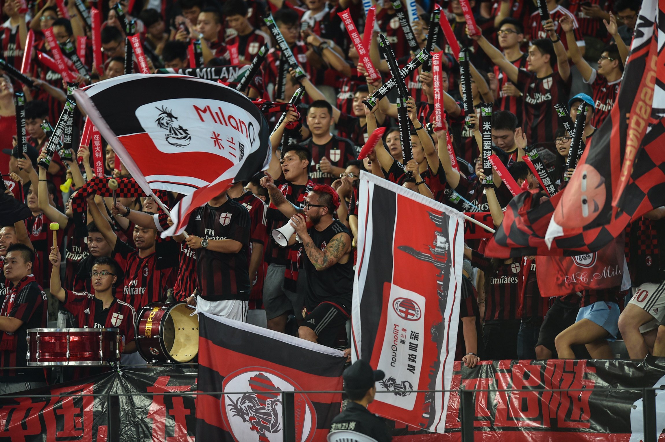 AC Milan fans cheer on their team during a International Champions Cup clash with Inter Milan in Shenzhen. Photo: Xinhua