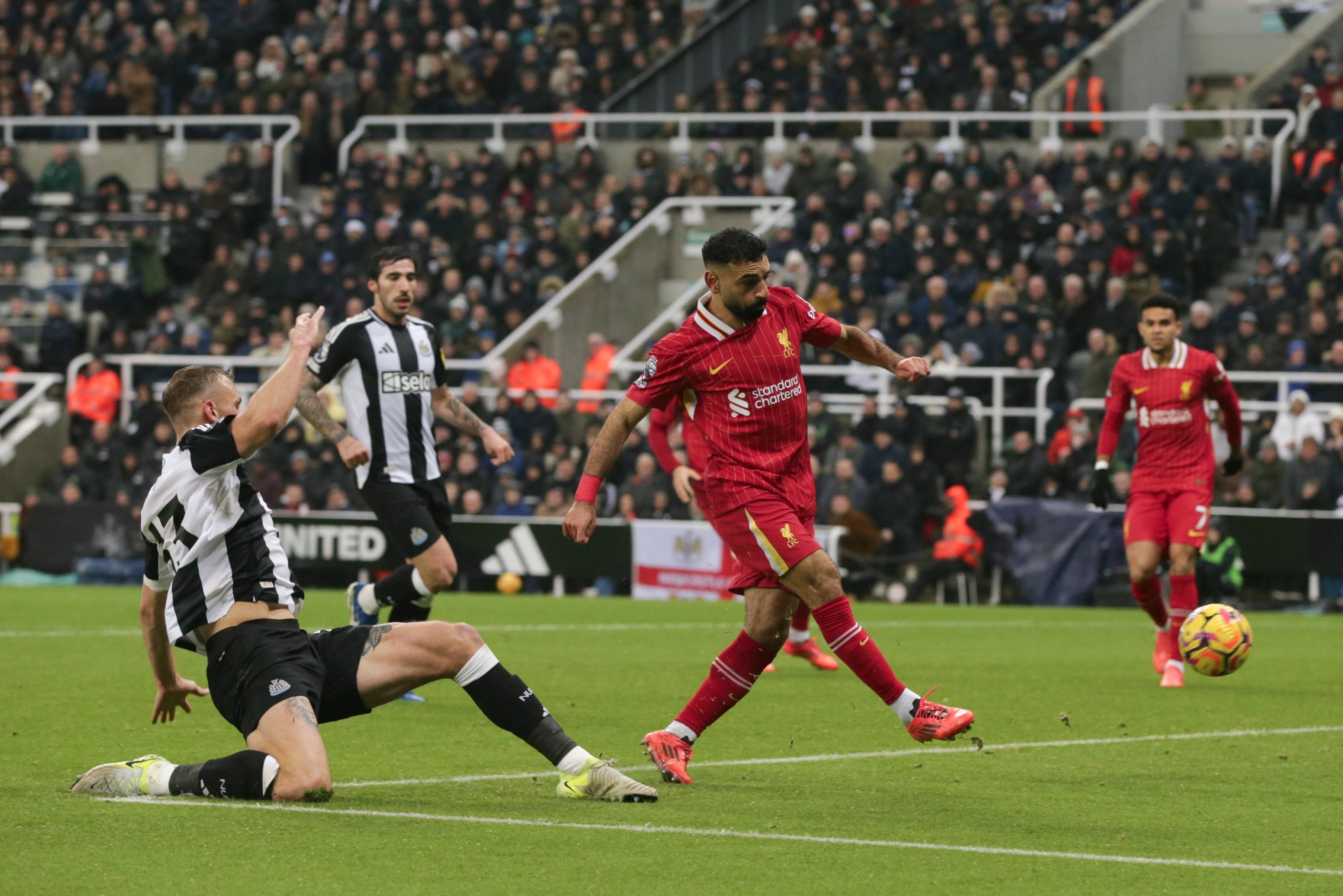 Liverpool’s Mohamed Salah scores his side’s second against Newcastle. Photo: AP