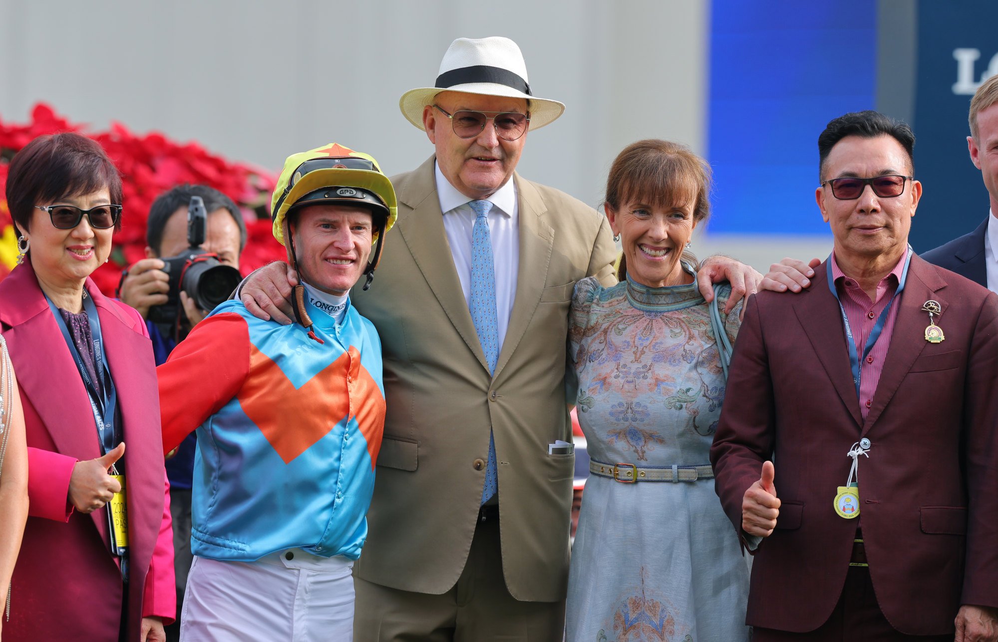 Jockey Zac Purton, trainer David Hayes (centre) and connections after Ka Ying Rising wins the Sprint.