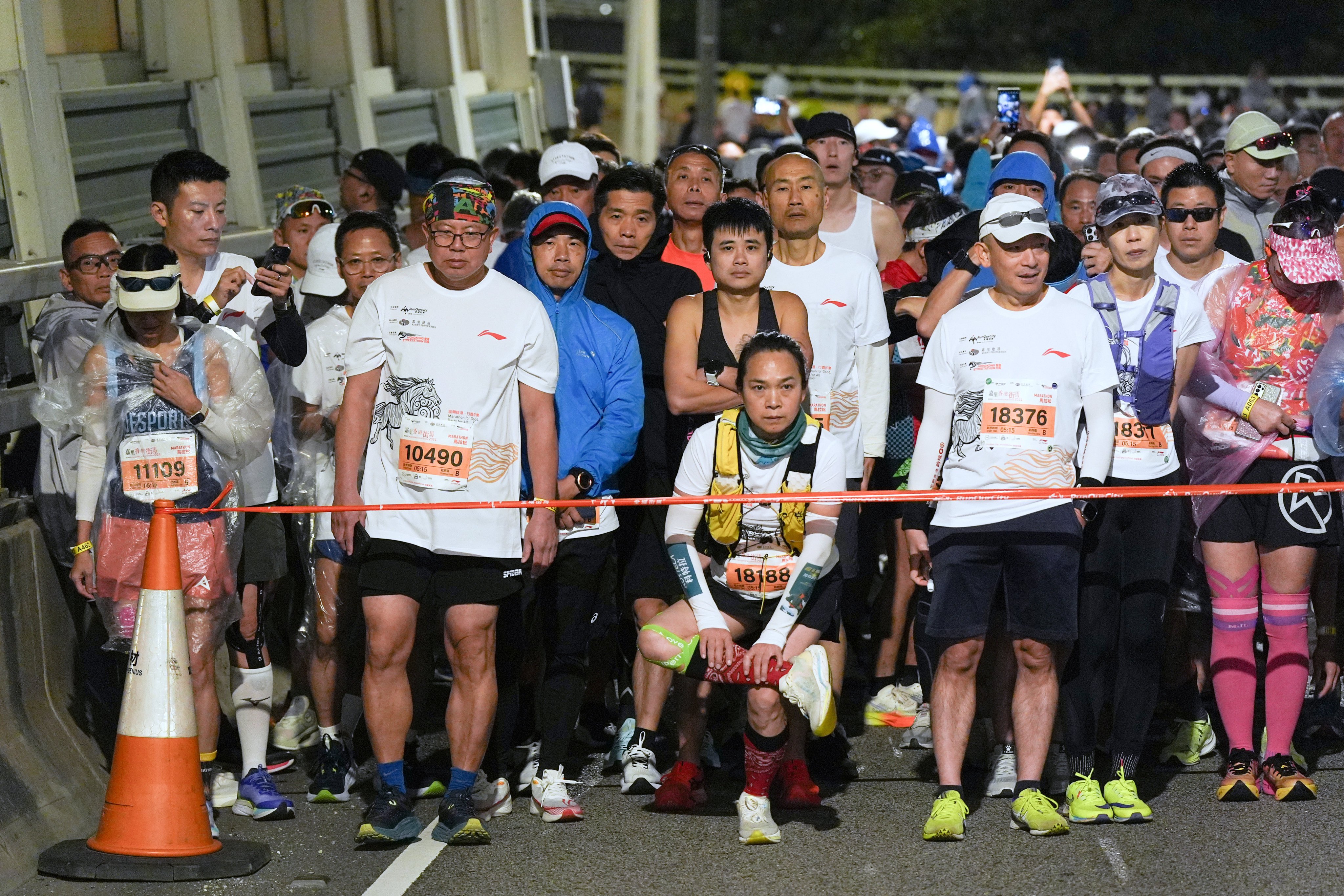 Runners warm up ahead of the Kerry Hong Kong Streetathon 2024. Photo: Eugene Lee