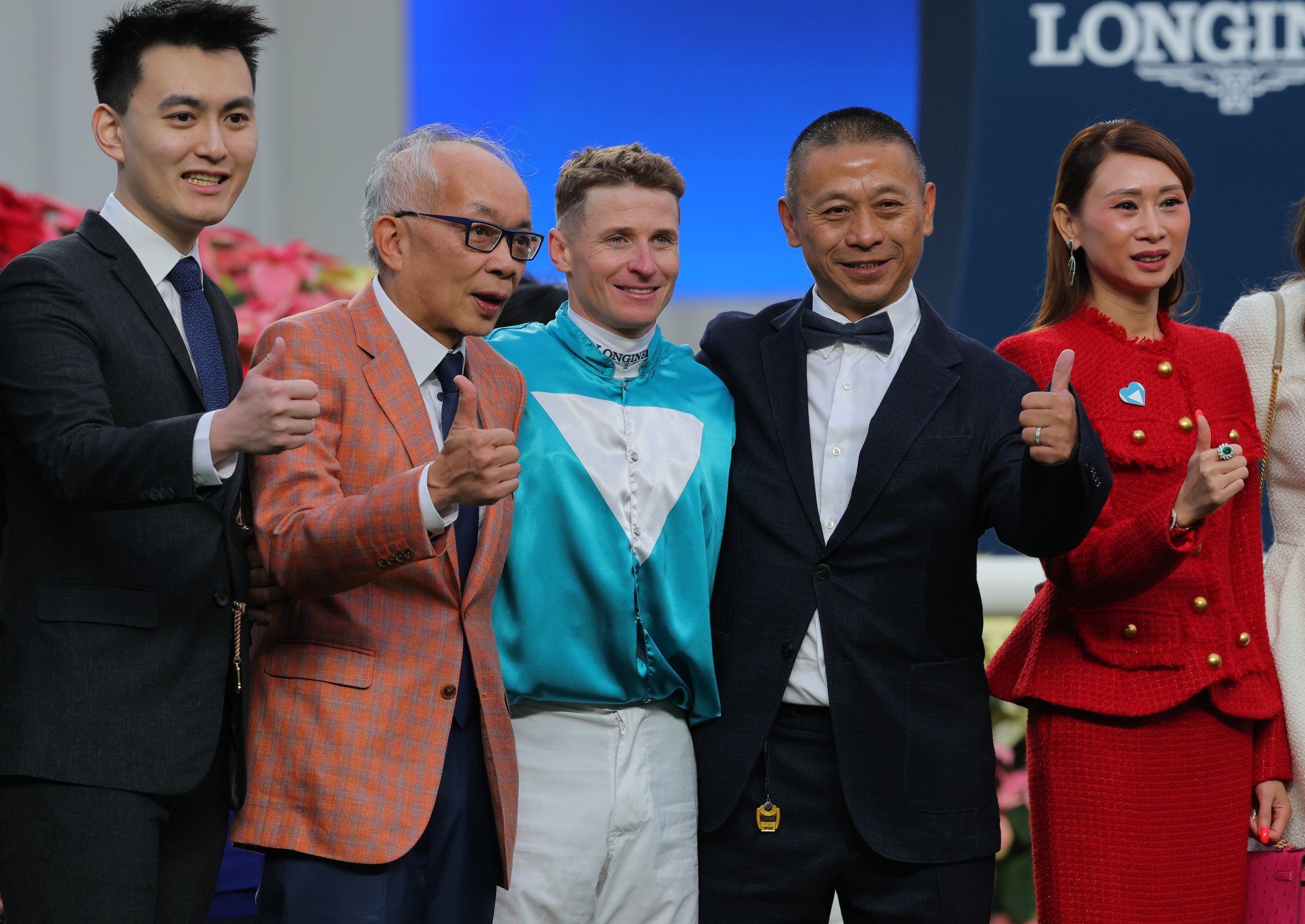 Owner Peter Lau (second from left), jockey James McDonald, trainer Danny Shum (second from right) and connections celebrate Romantic Warrior’s win.