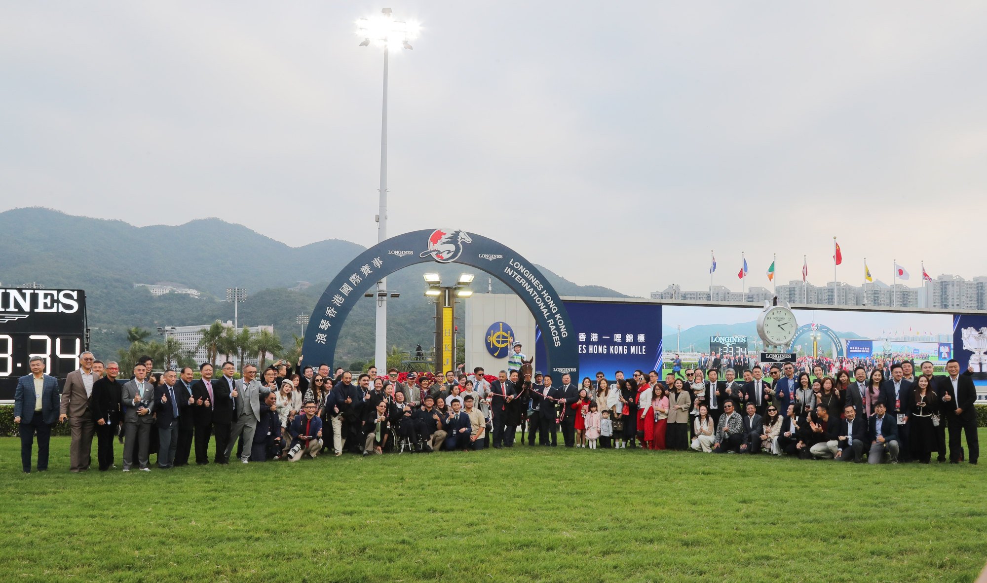 Voyage Bubble and his legion of owners celebrate his Hong Kong Mile success.