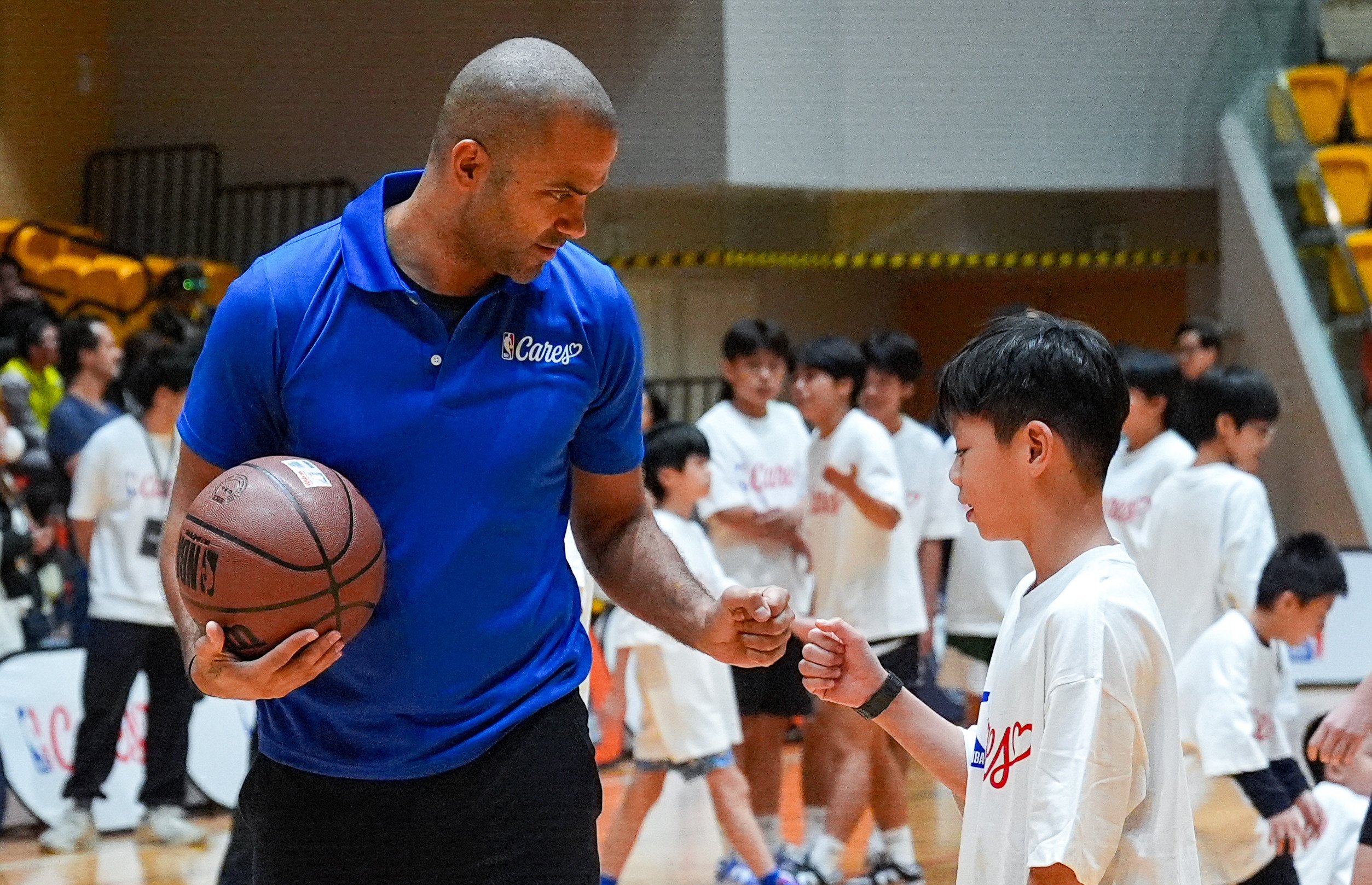 Hall of famer Tony Parker took part in a coaching session at the NBA Fan Fest at Tusen Wan Sports Centre. Photo: Eugene Lee