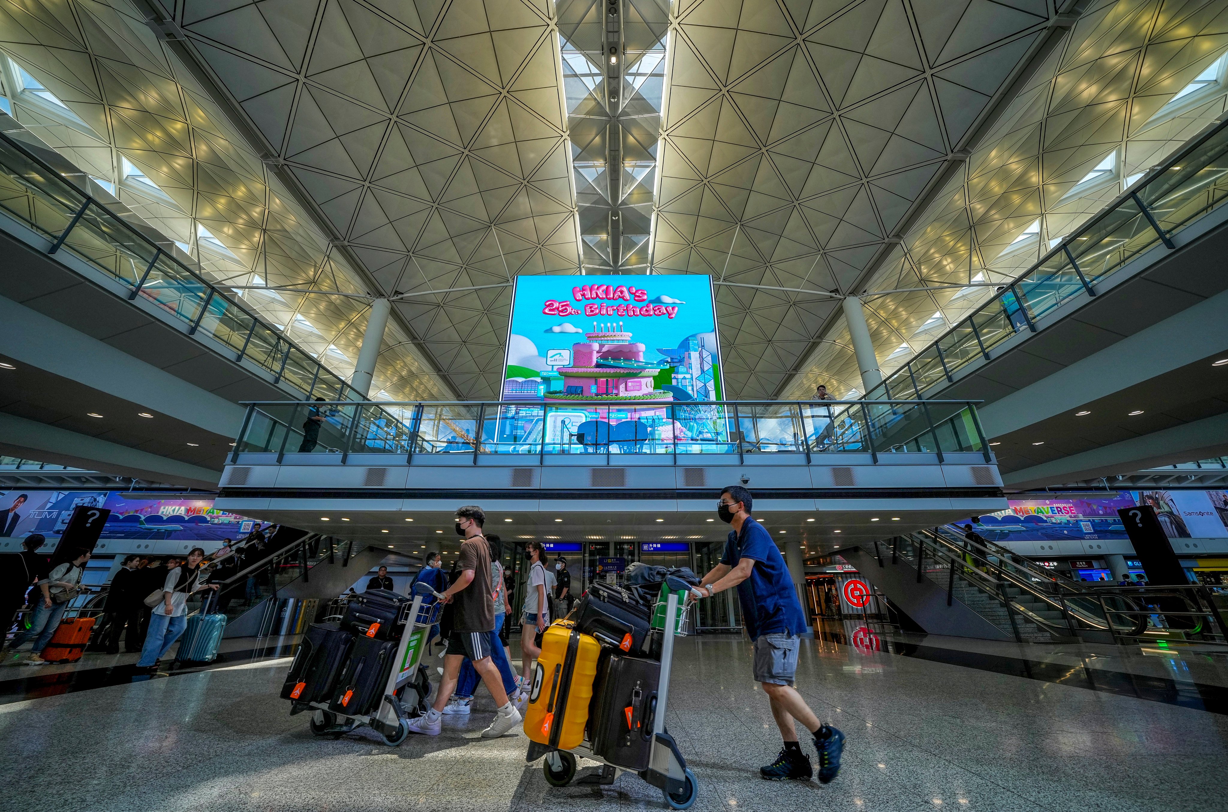 Travellers at the arrival hall of the Hong Kong International Airport in Chek Lap Kok. Photo: Elson Li