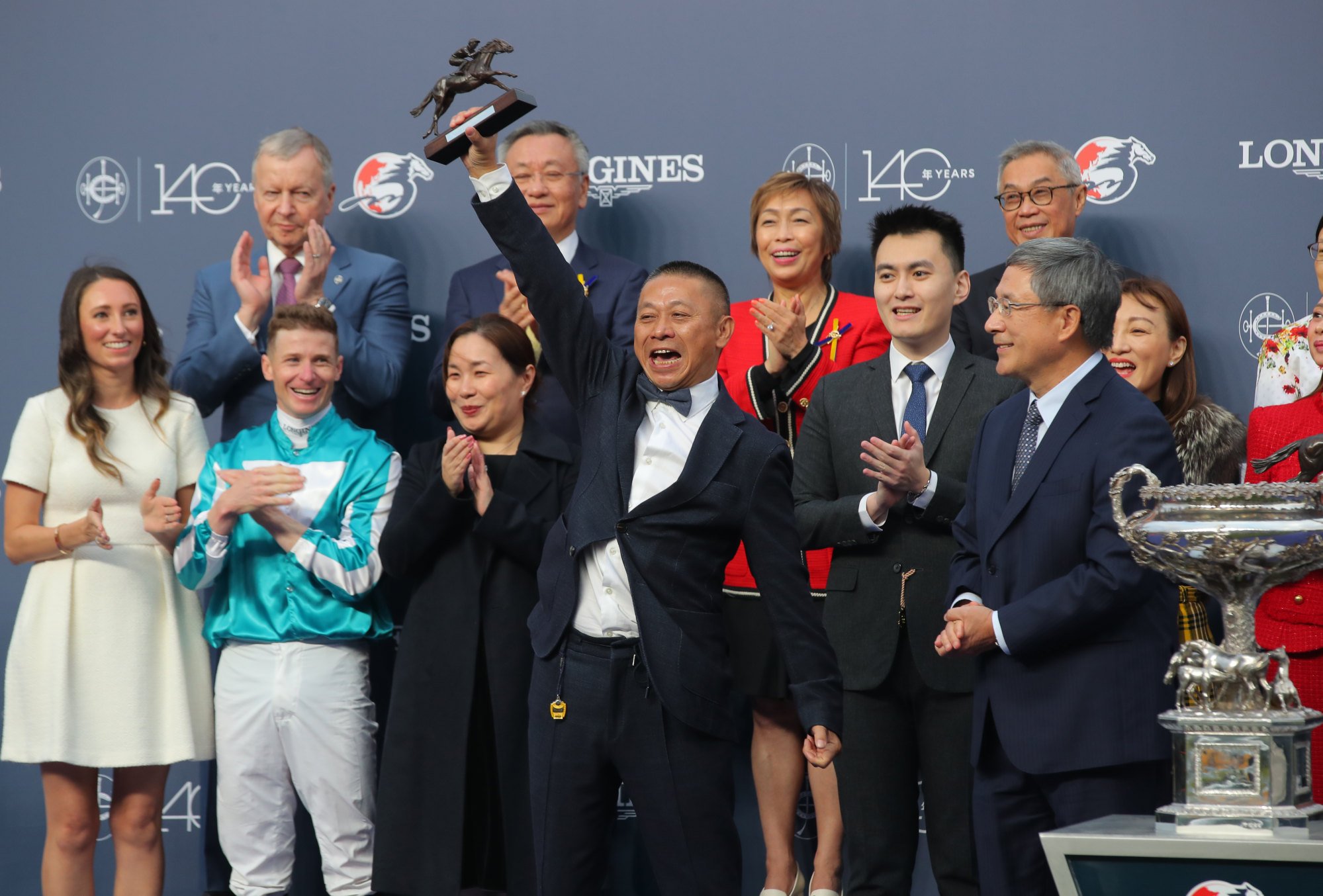 Trainer Danny Shum celebrates Romantic Warrior’s record Hong Kong Cup triumph.