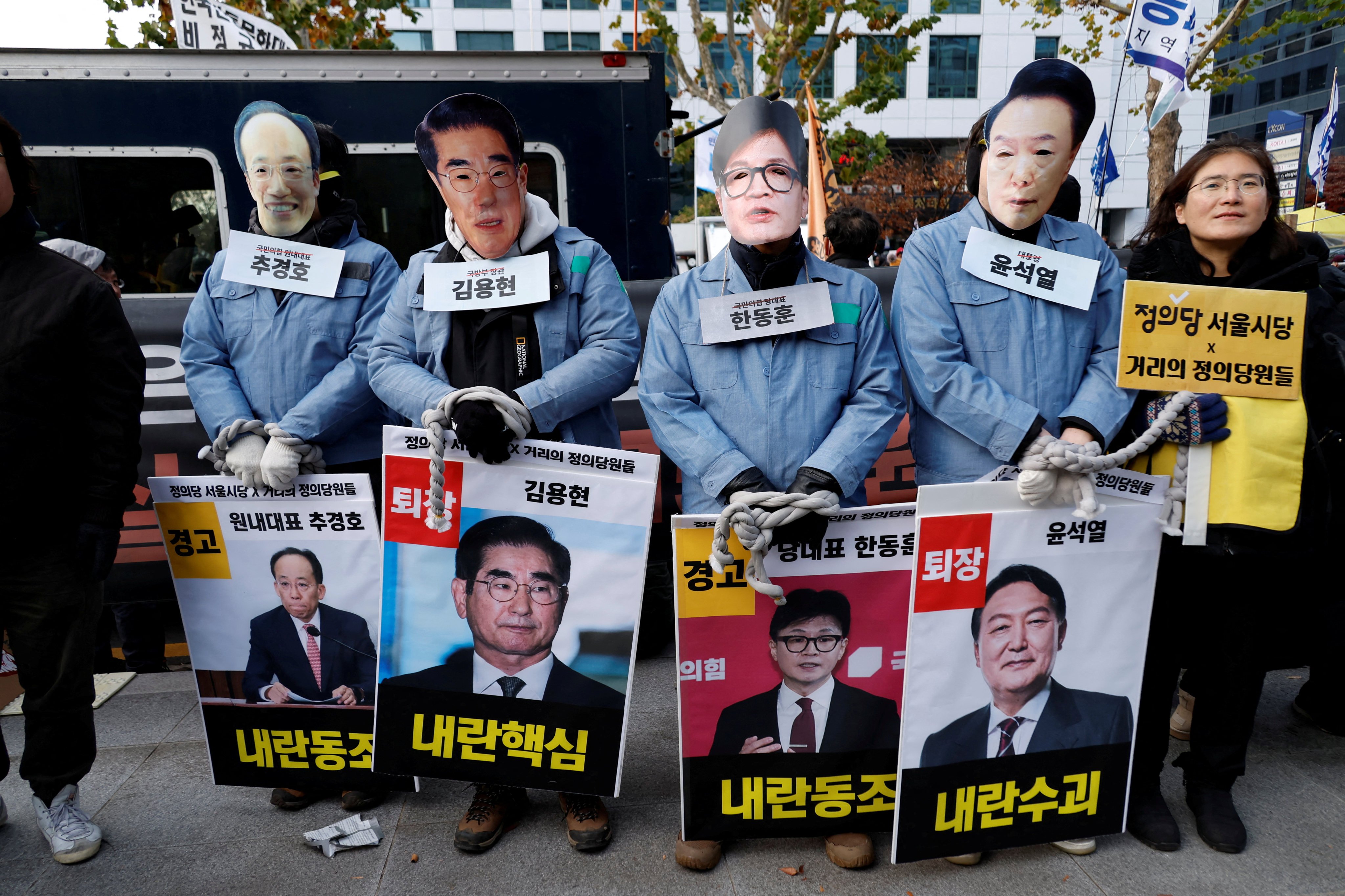 Protesters wear masks depicting South Korean President Yoon Suk Yeol, outgoing Defense Minister Kim Yong-hyun, People Power Party’s leader Han Dong-hoon, and Choo Kyung-ho at a rally calling for the impeachment of South Korean President Yoon Suk Yeol on Sunday. Photo: Reuters