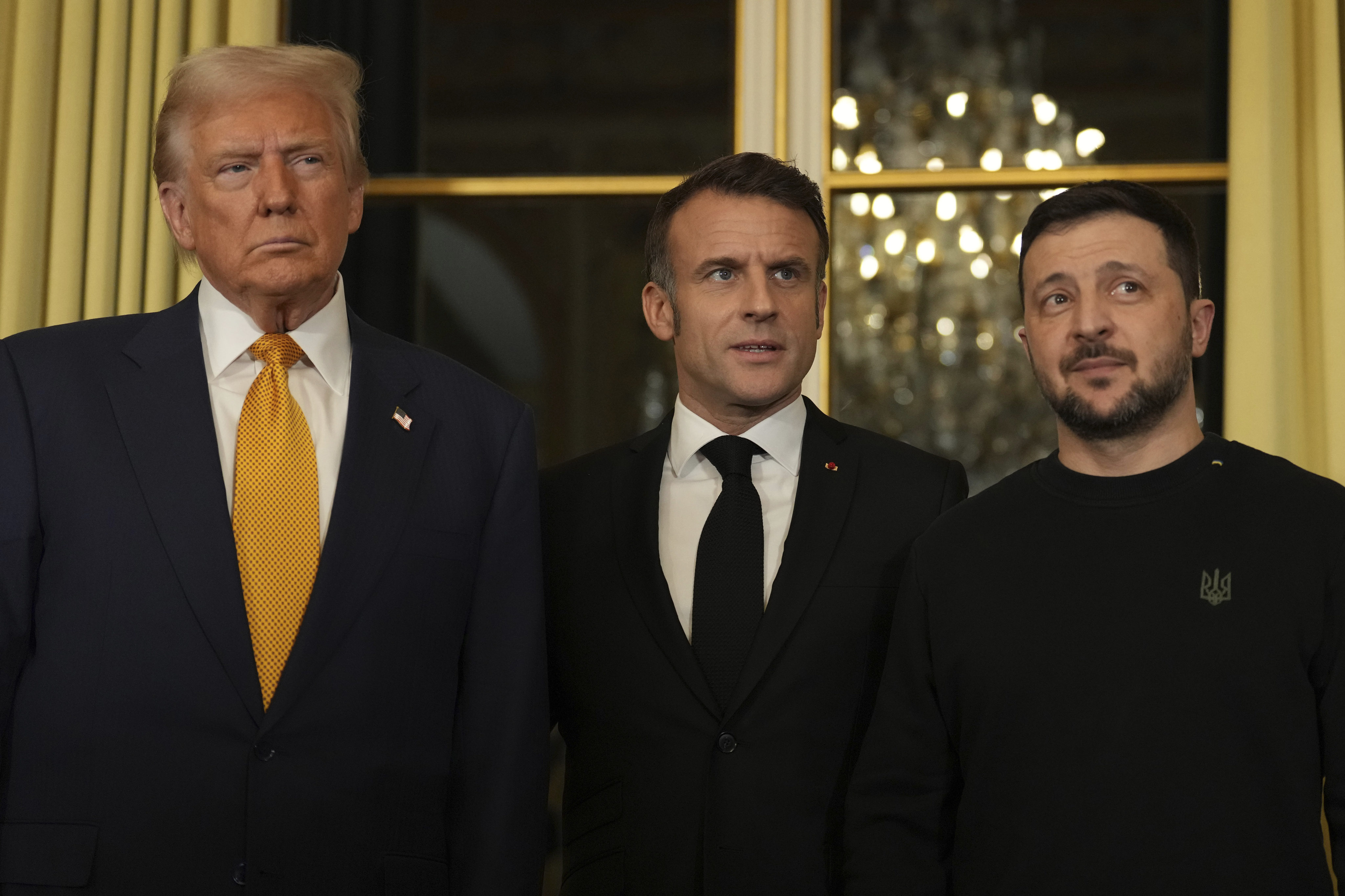 French President Emmanuel Macron (centre) poses with US president-elect Donald Trump (left) and Ukraine’s President Volodymyr Zelensky at the Elysee Palace on Saturday. Photo: AP