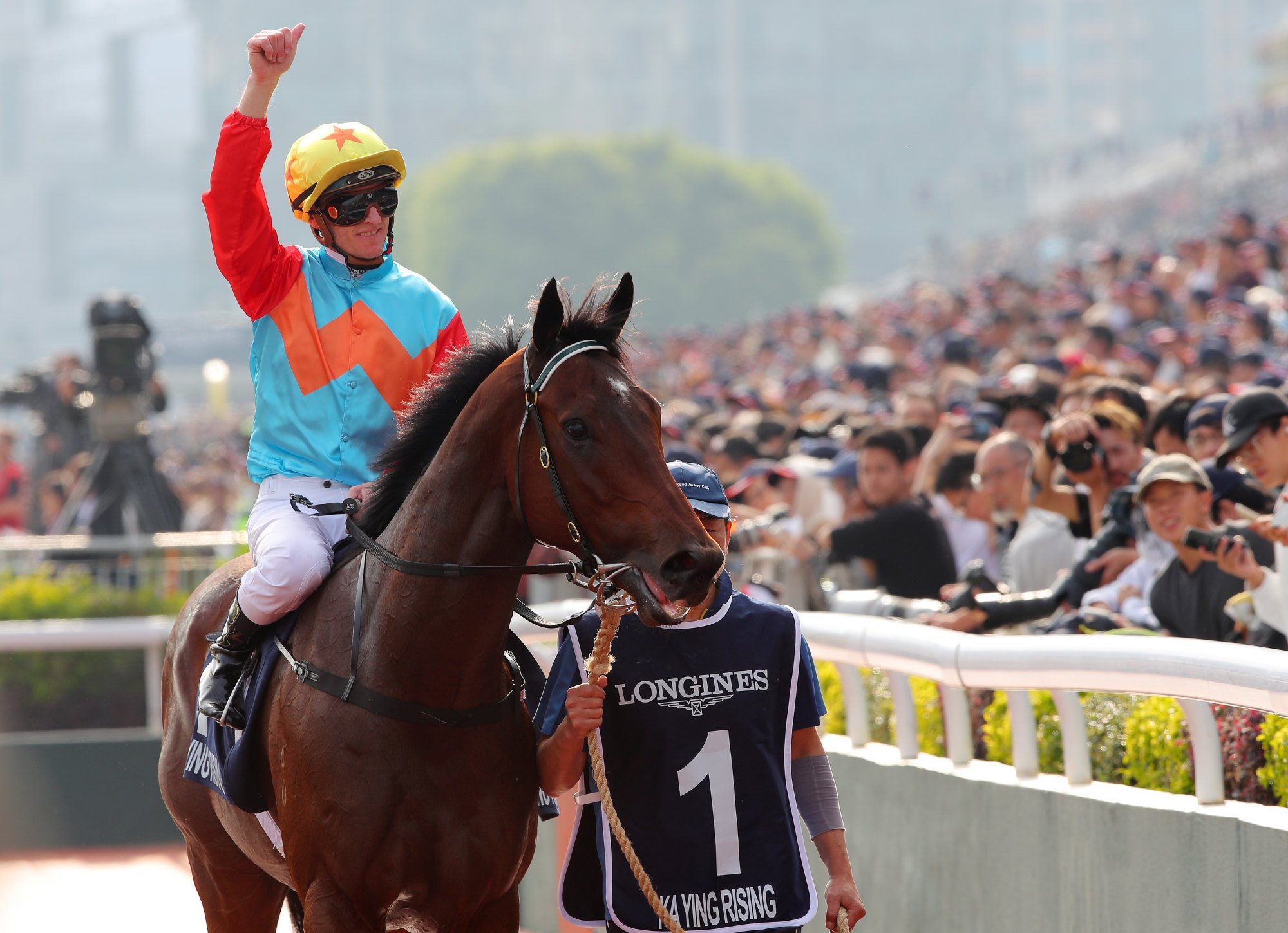 Zac Purton celebrates after Ka Ying Rising takes out the Hong Kong Sprint.