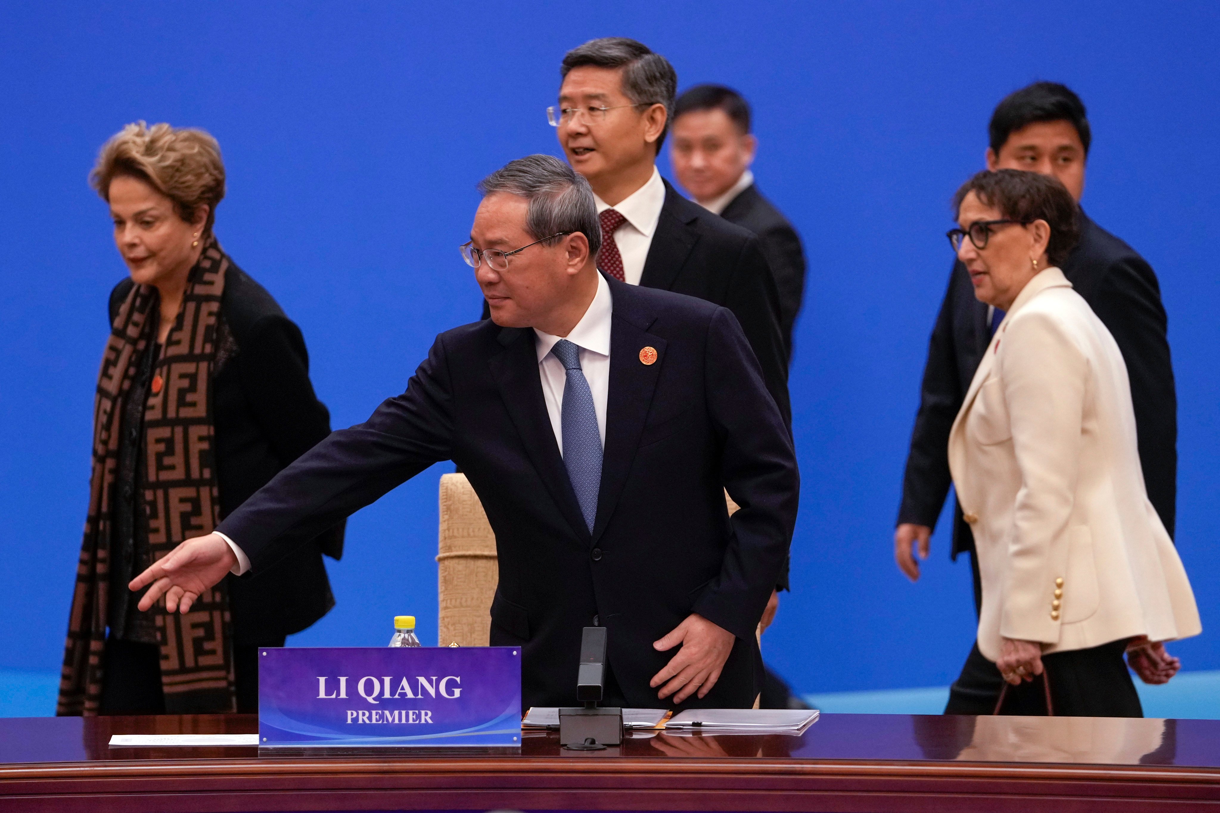 Premier Li Qiang (centre) gestures as the president of the New Development Bank, Dilma Rousseff, left, and Rebeca Grynspan, right, secretary-general of the United Nations Conference on Trade and Development, arrive at the “1+10” Dialogue on Building Consensus on Development to Promote Global Common Prosperity in Beijing on Monday. Photo: AP