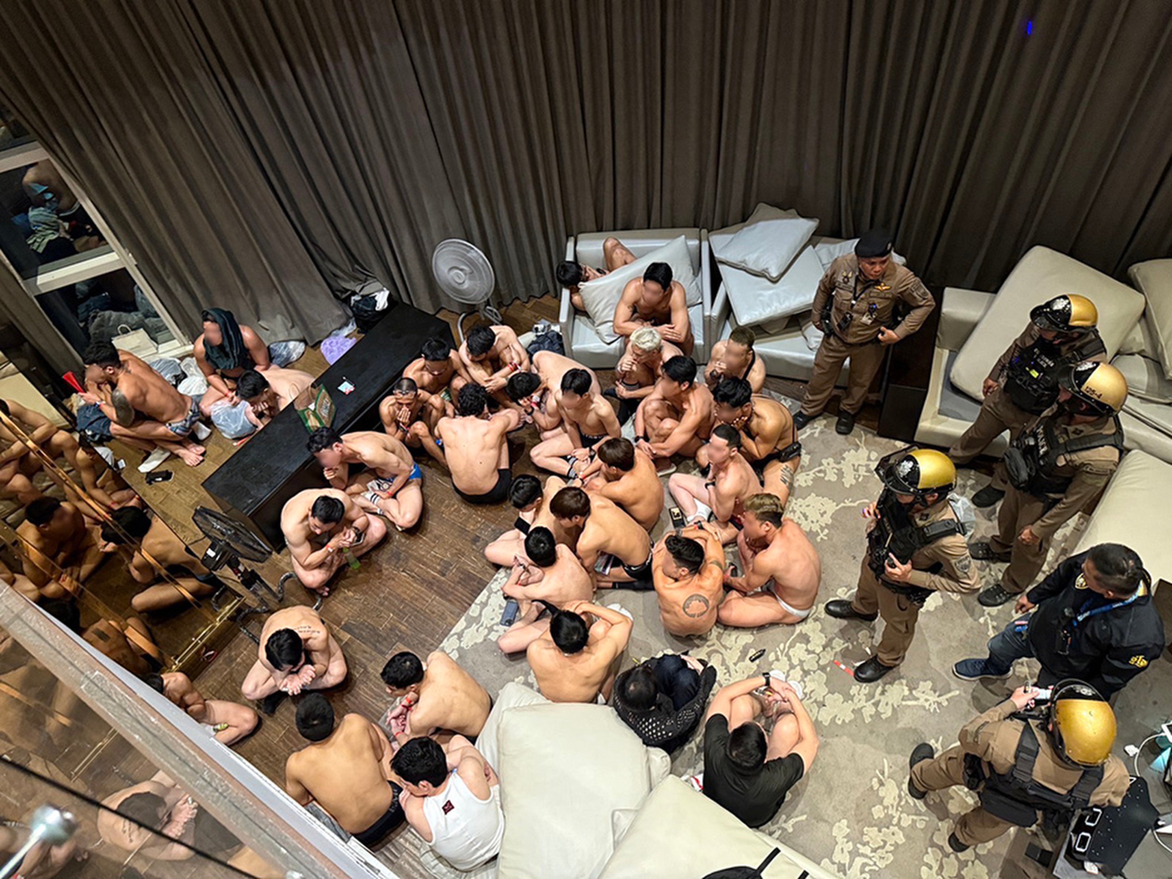 Police raid a party in downtown Bangkok, where hundreds of attendees, including three foreigners, were subjected to hours-long drug testing on December 8, 2024. Photo: Thonglor Police