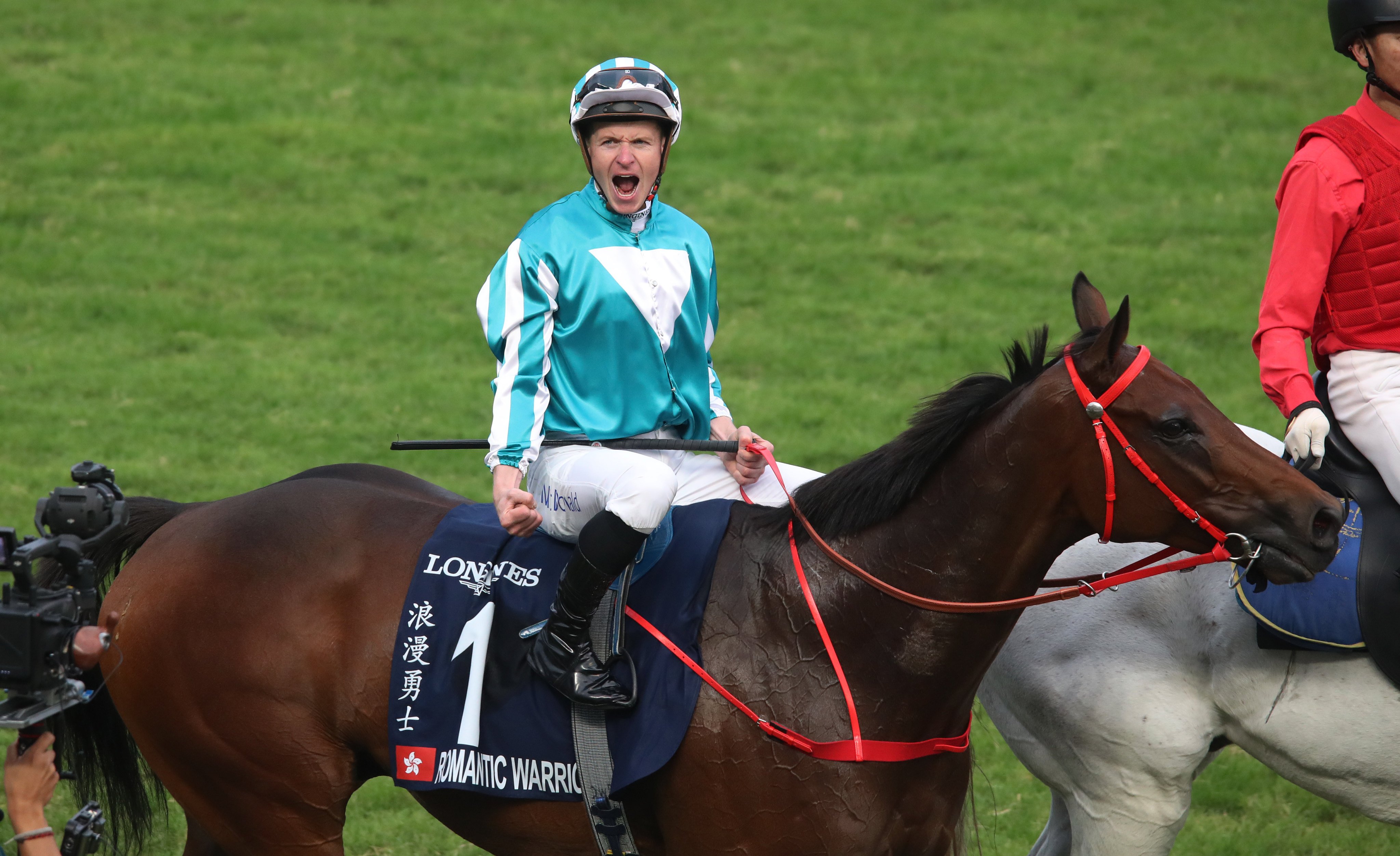 James McDonald and Zac Purton lock horns at Happy Valley on Wednesday. Photos: Kenneth Chan