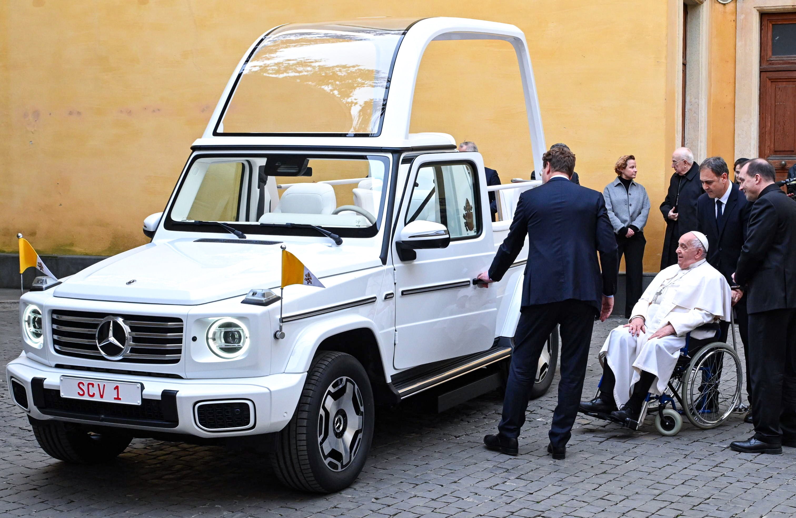 Pope Francis receives the new Mercedes-Benz electric Popemobile at the Vatican. Photo: EPA-EFE