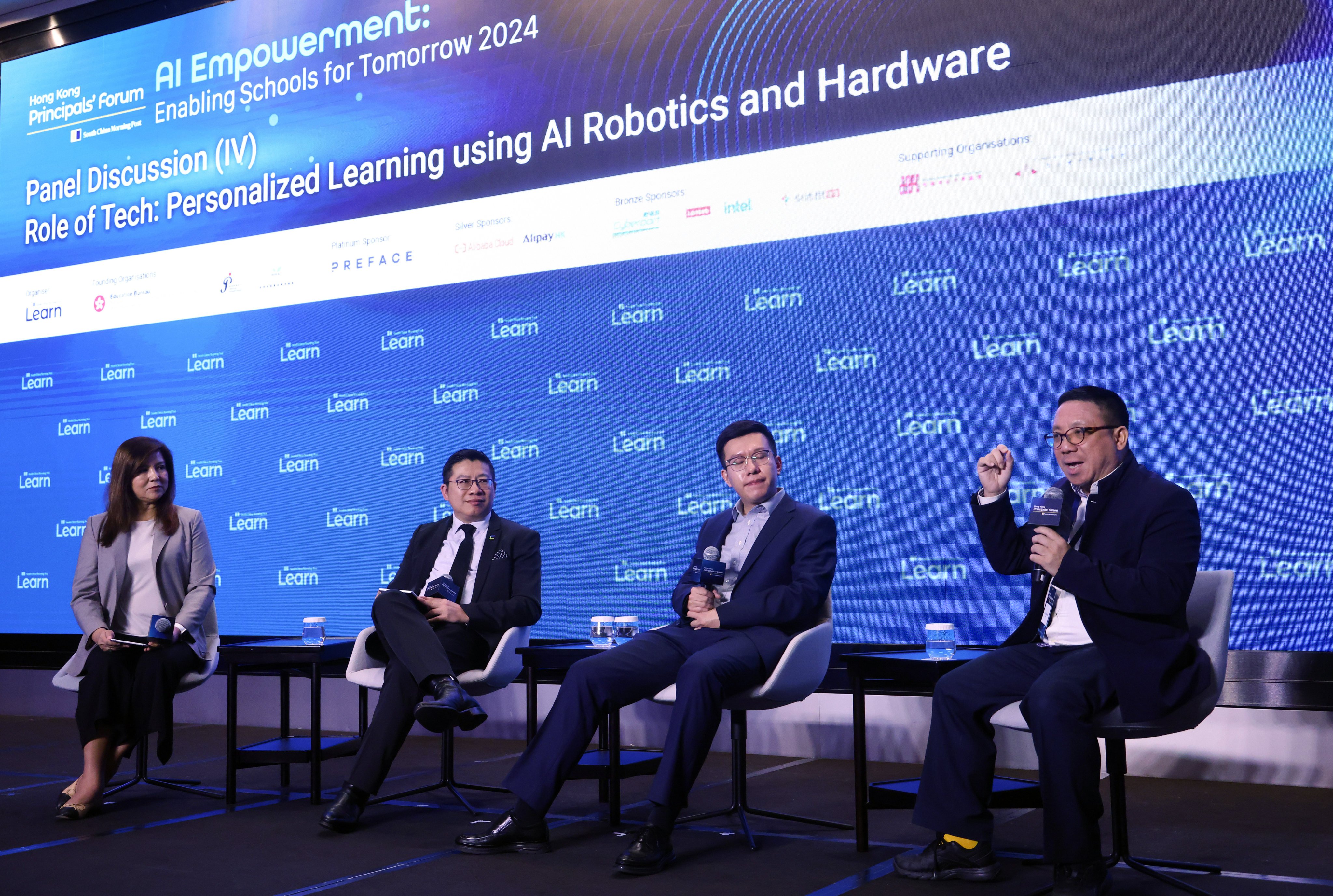 (From left) Zuraidah Ibrahim, the SCMP’s executive managing editor, Ricky Choi, Cyberport’s director of smart living, Zhizheng Zhang, VP of large models at Galbot, and Eddie Hui, digital innovations lead at Lenovo, take part in a panel discussion at the forum. Photo: Dickson Lee