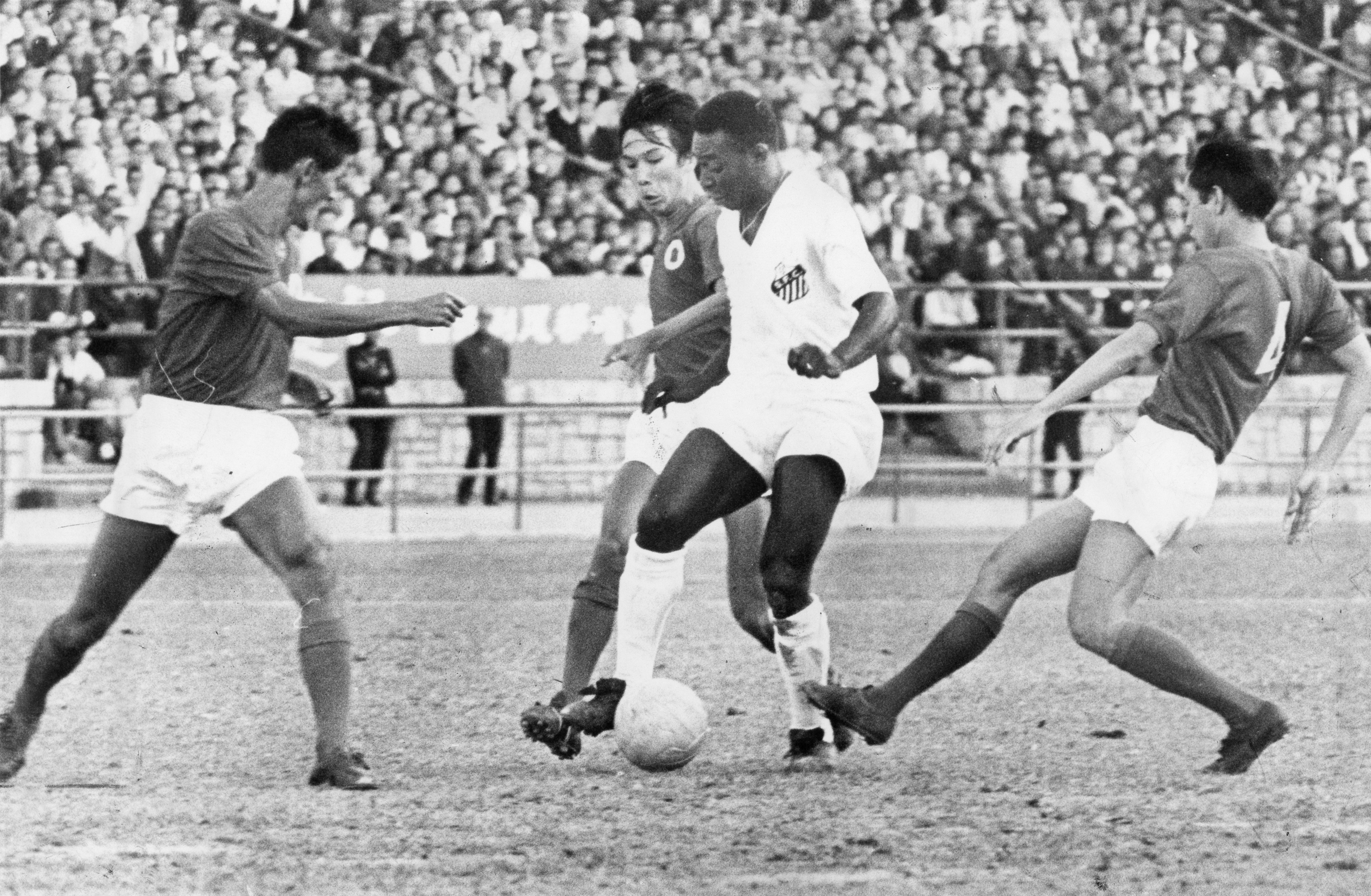 Pele (in white), of the Brazilian football team Santos, in action against the Hong Kong League XI at the Hong Kong Stadium,in 1970. Photo: SCMP Archives