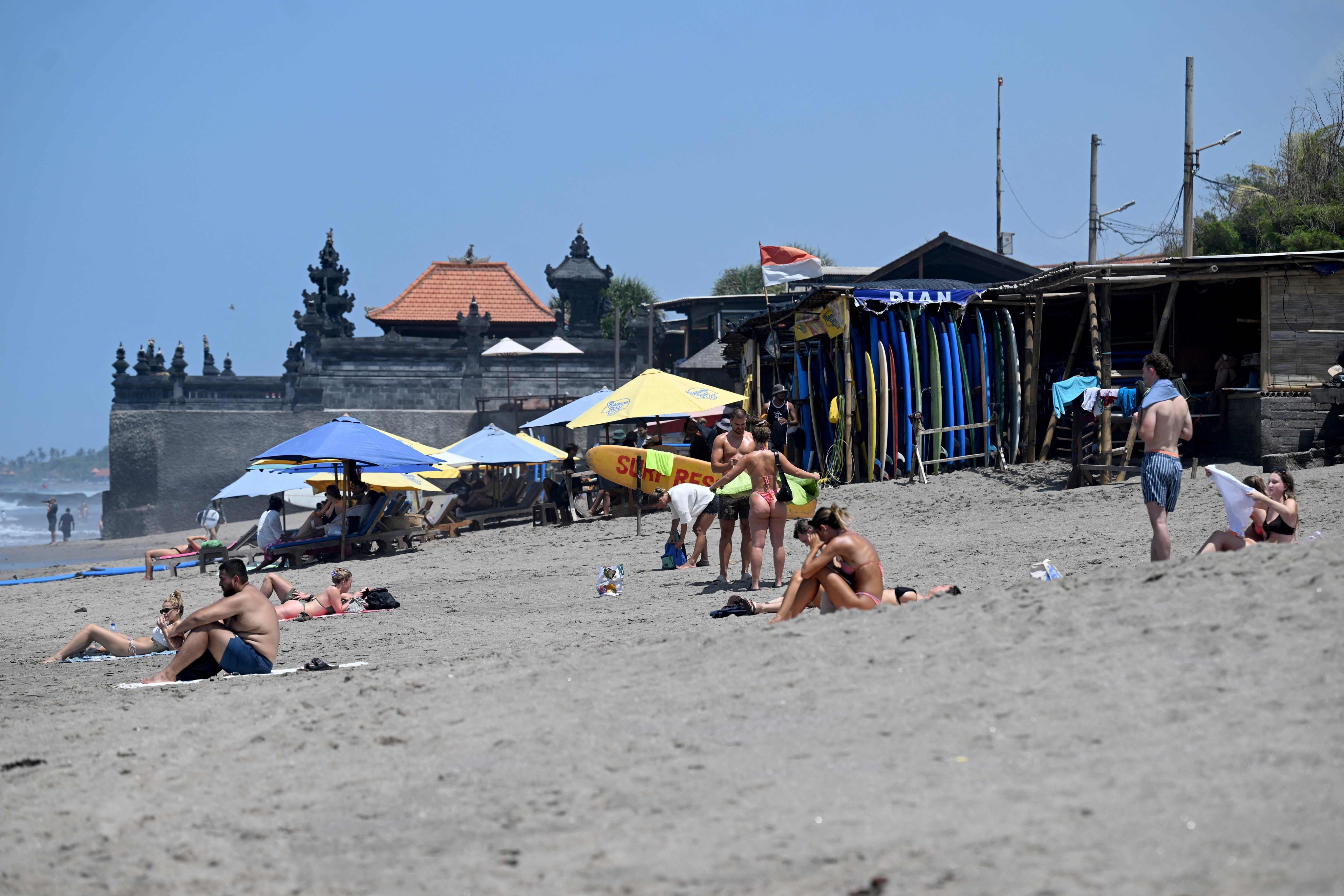 Foreign tourists relaxing at a beach in Canggu, Badung regency, Bali island. Photo: AFP