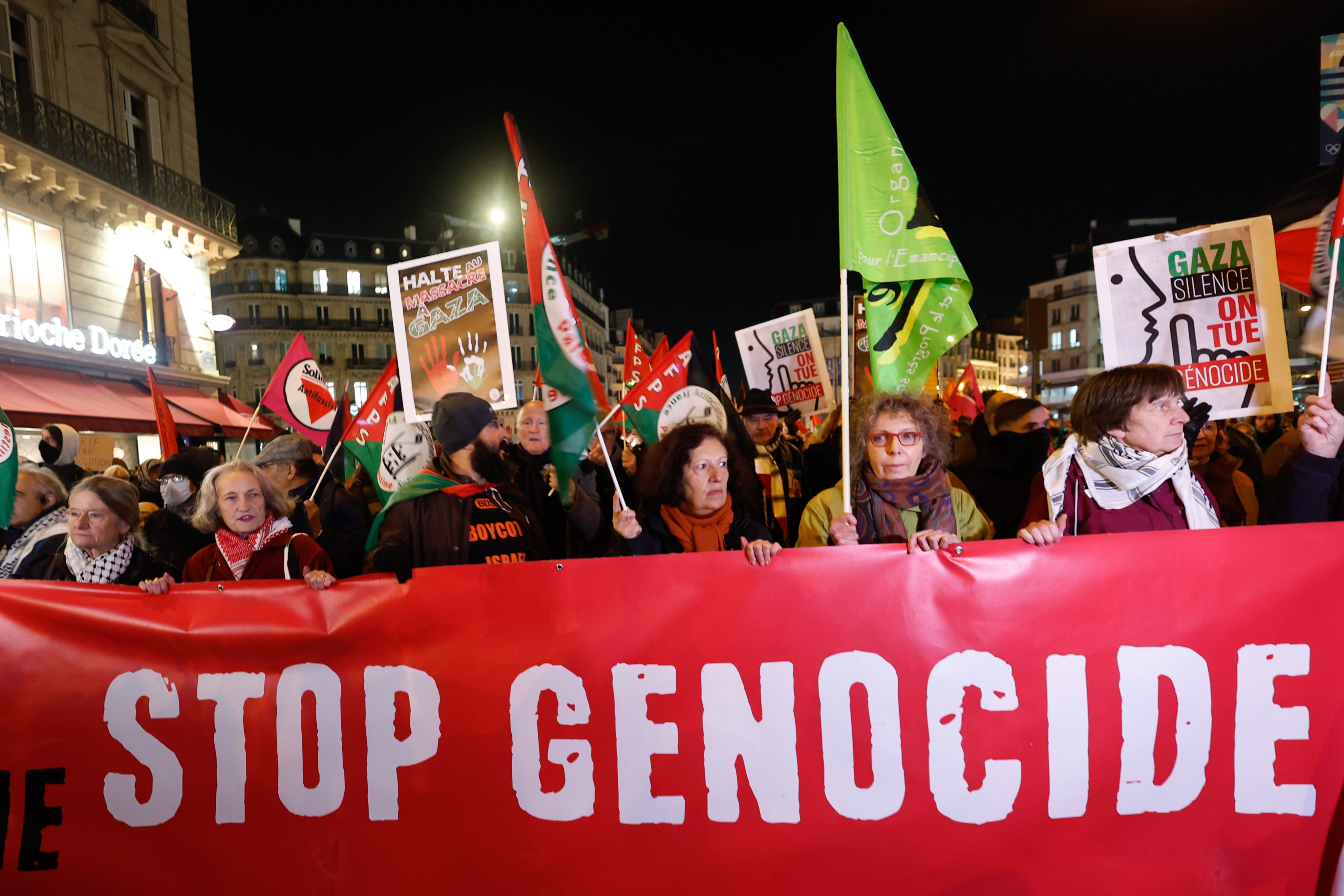 Demonstrators hold a banner reading “Stop Genocide” during a protest organised by pro-Palestinian associations and French leftist parties in Paris, November 13, 2024. Photo: EPA/EFE