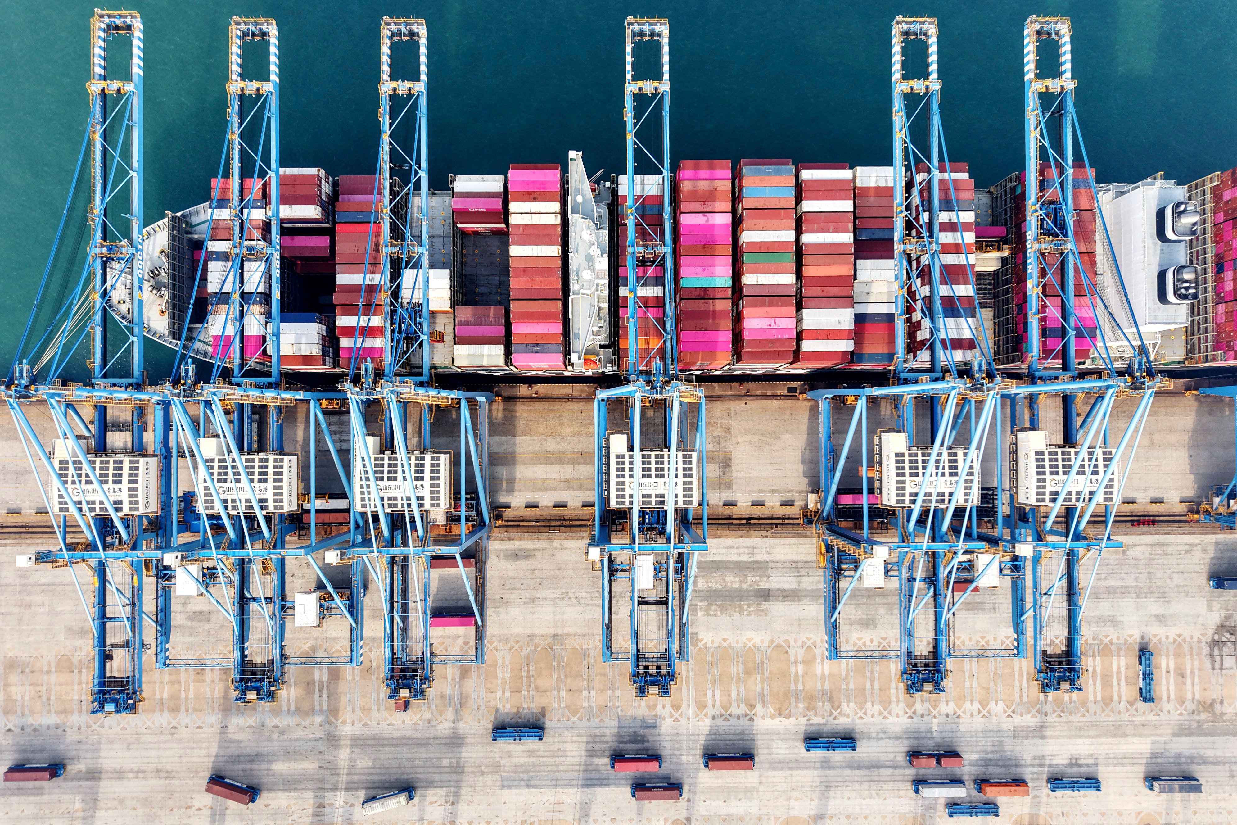 Aerial view of cranes and a ship at a container terminal in Qingdao city in east China’s Shandong province. Photo: AP