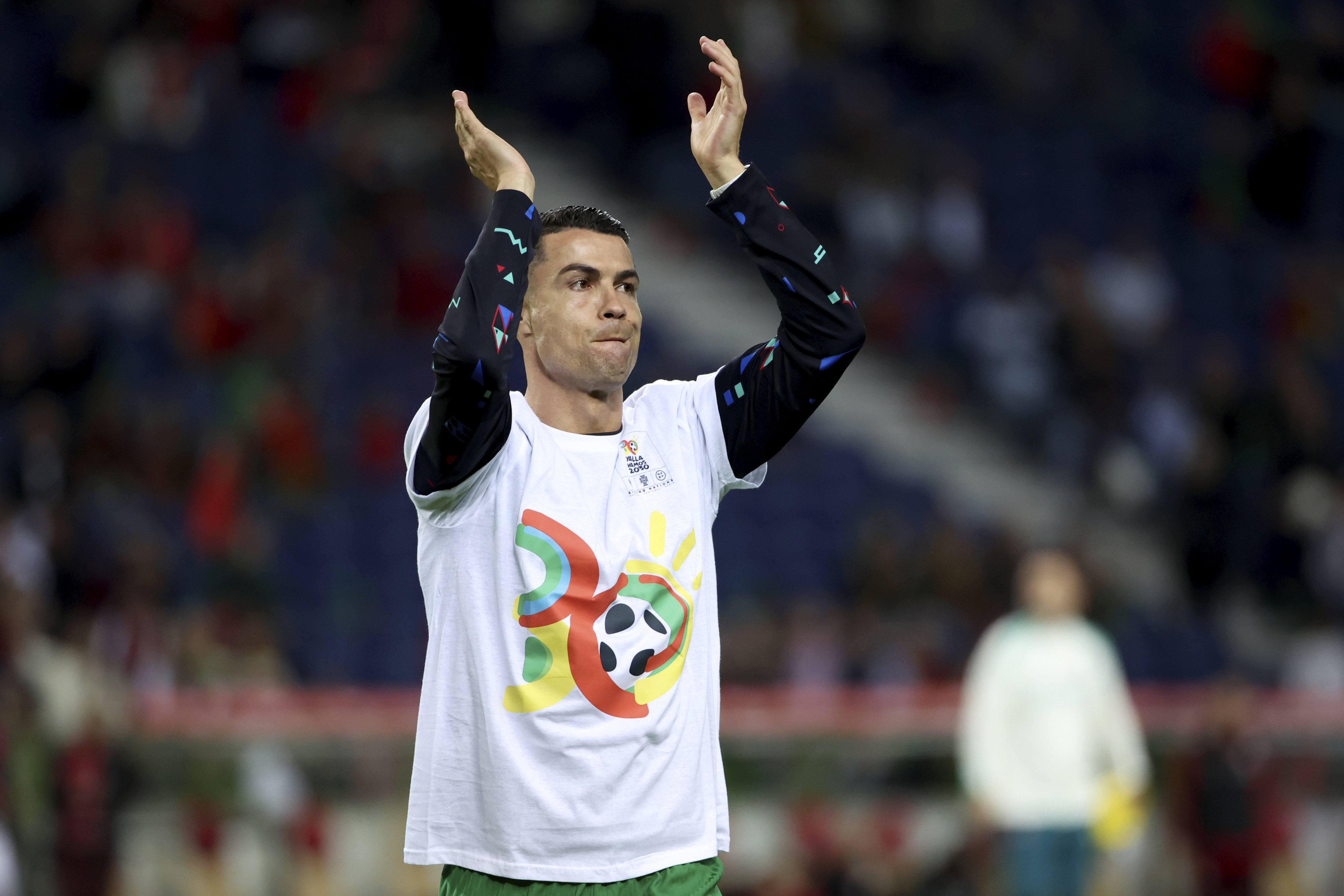 Portugal’s Cristiano Ronaldo, wearing a World Cup 2030 T-shirt, applauds fans during the warmup before a Uefa Nations League match between Portugal and Poland last month. Photo: AP