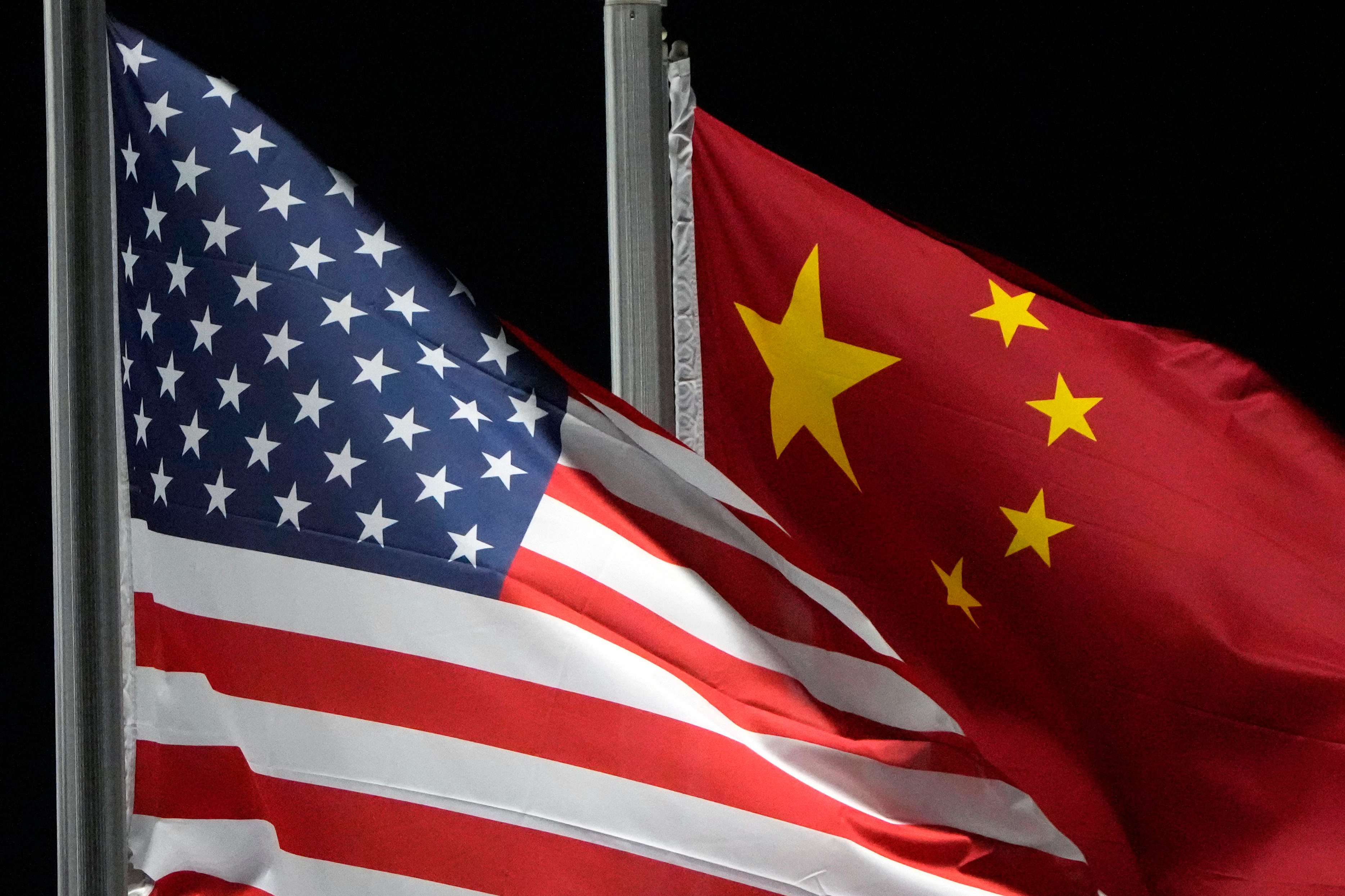 The American and Chinese flags wave ahead of the 2022 Winter Olympics in February 2022, in Zhangjiakou, China. China. Photo: AP