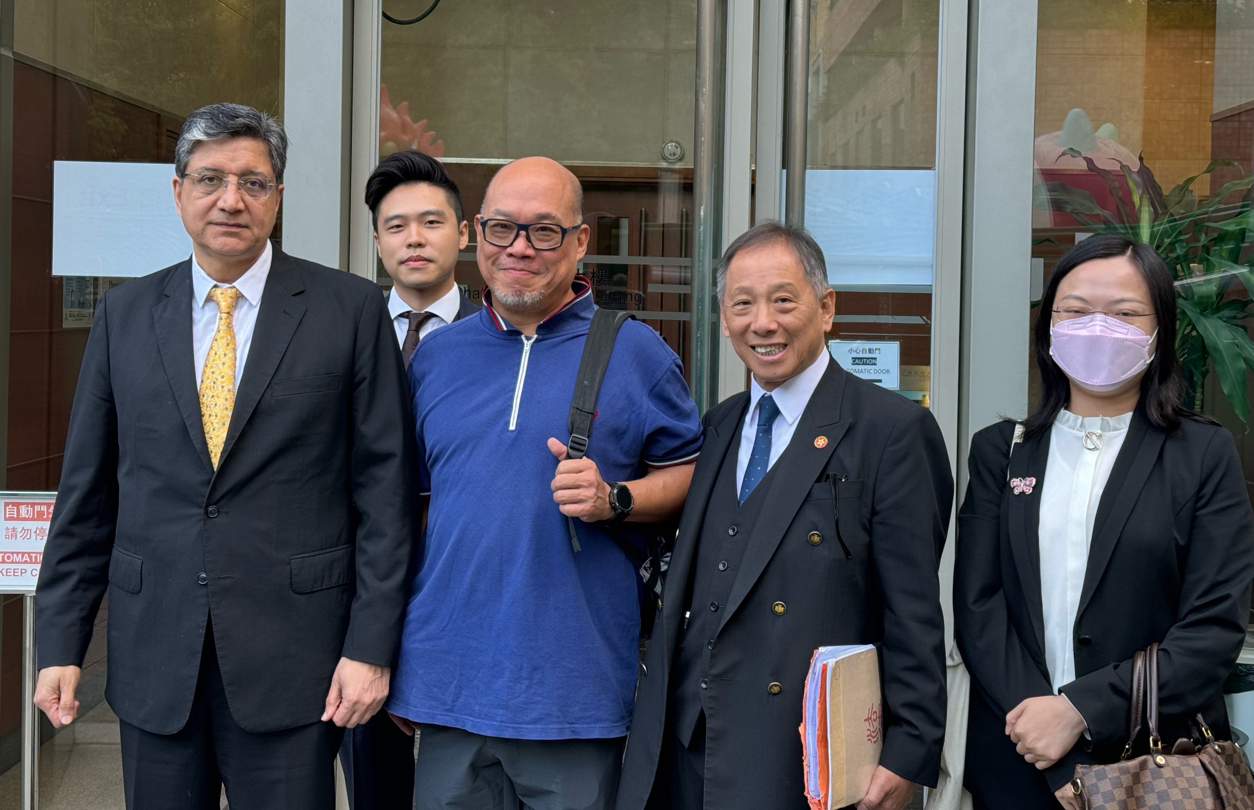 Kelvin Ip (centre) with his lawyer David Khosa (left) on Tuesday after the trial. Photo: Lo Hoi-ying