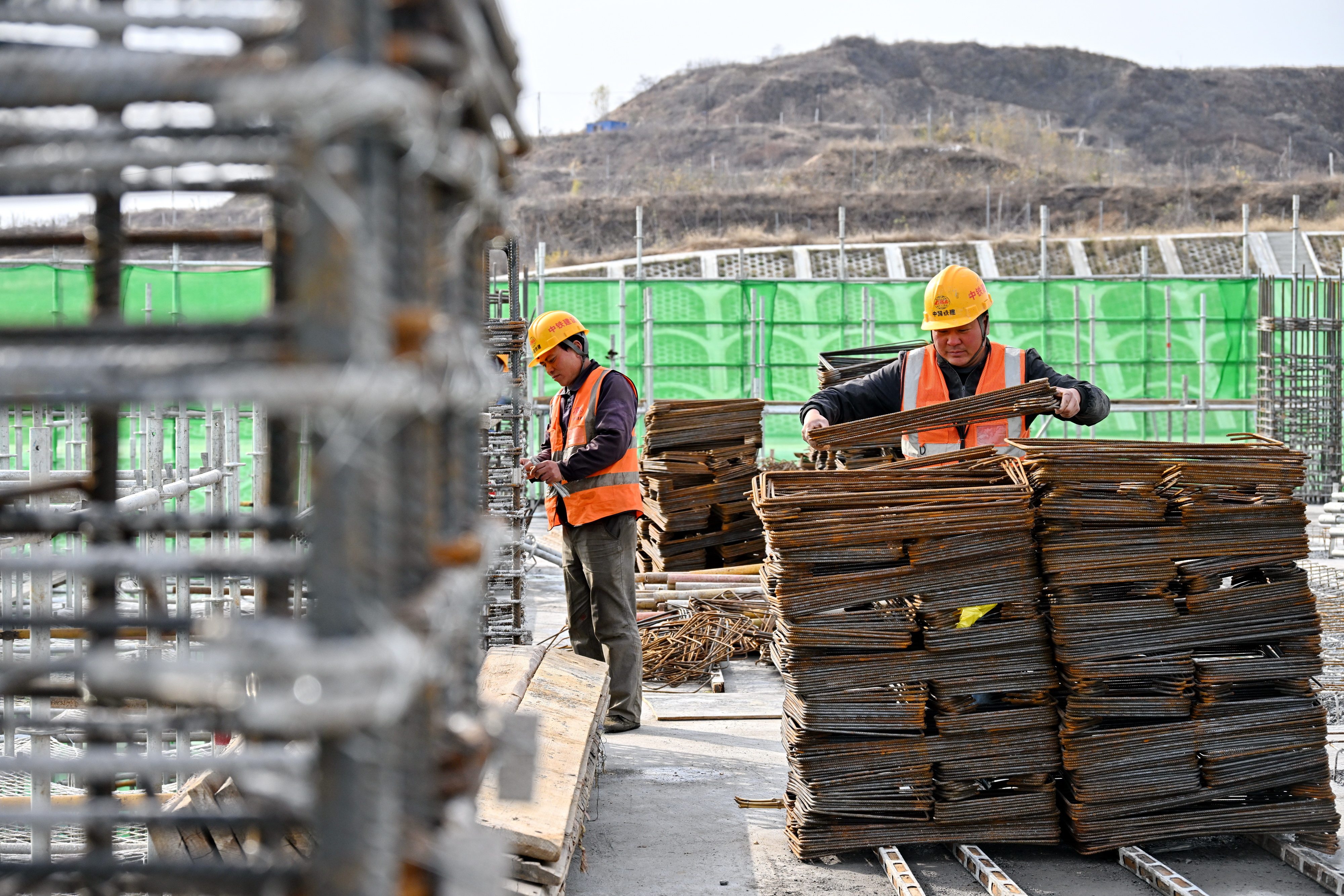 Workers handle components used to build a high-speed railway in China’s Hebei province last month. Photo: Xinhua