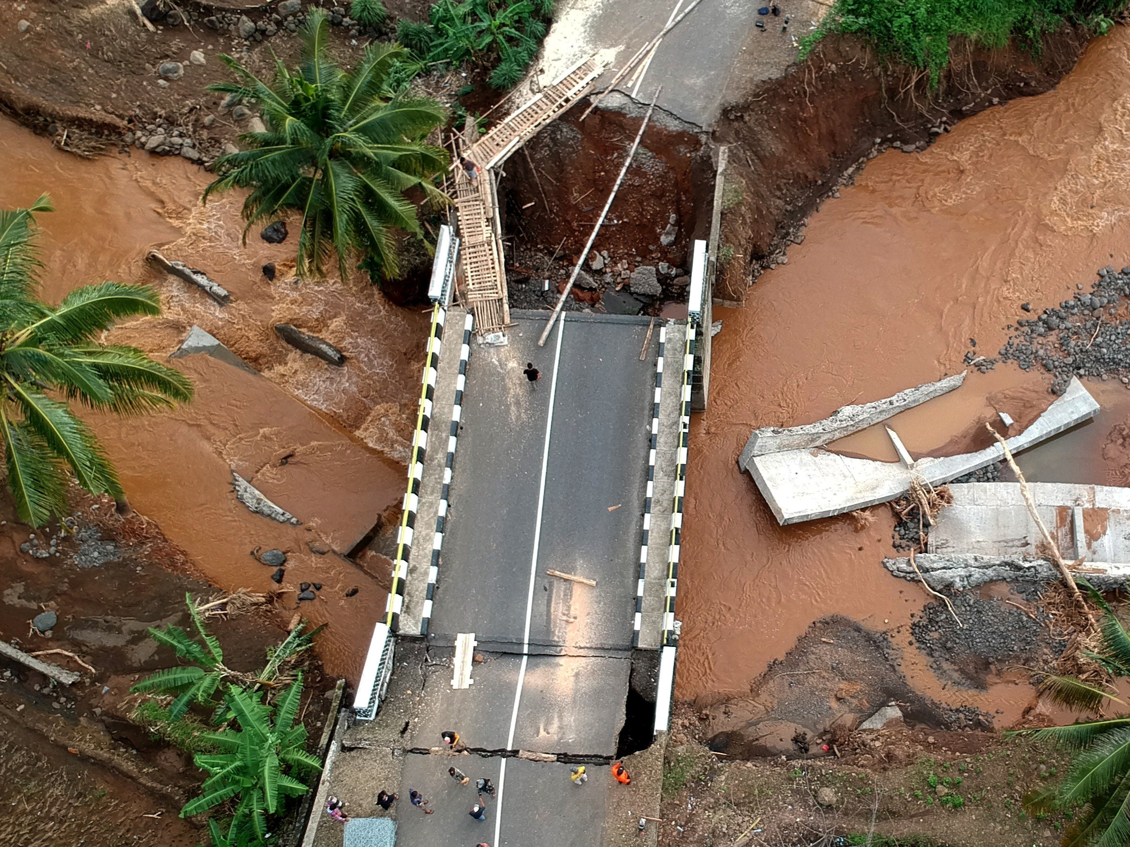 An aerial view of a bridge damaged by floods in Indonesia’s West Java province. Photo: Xinhua