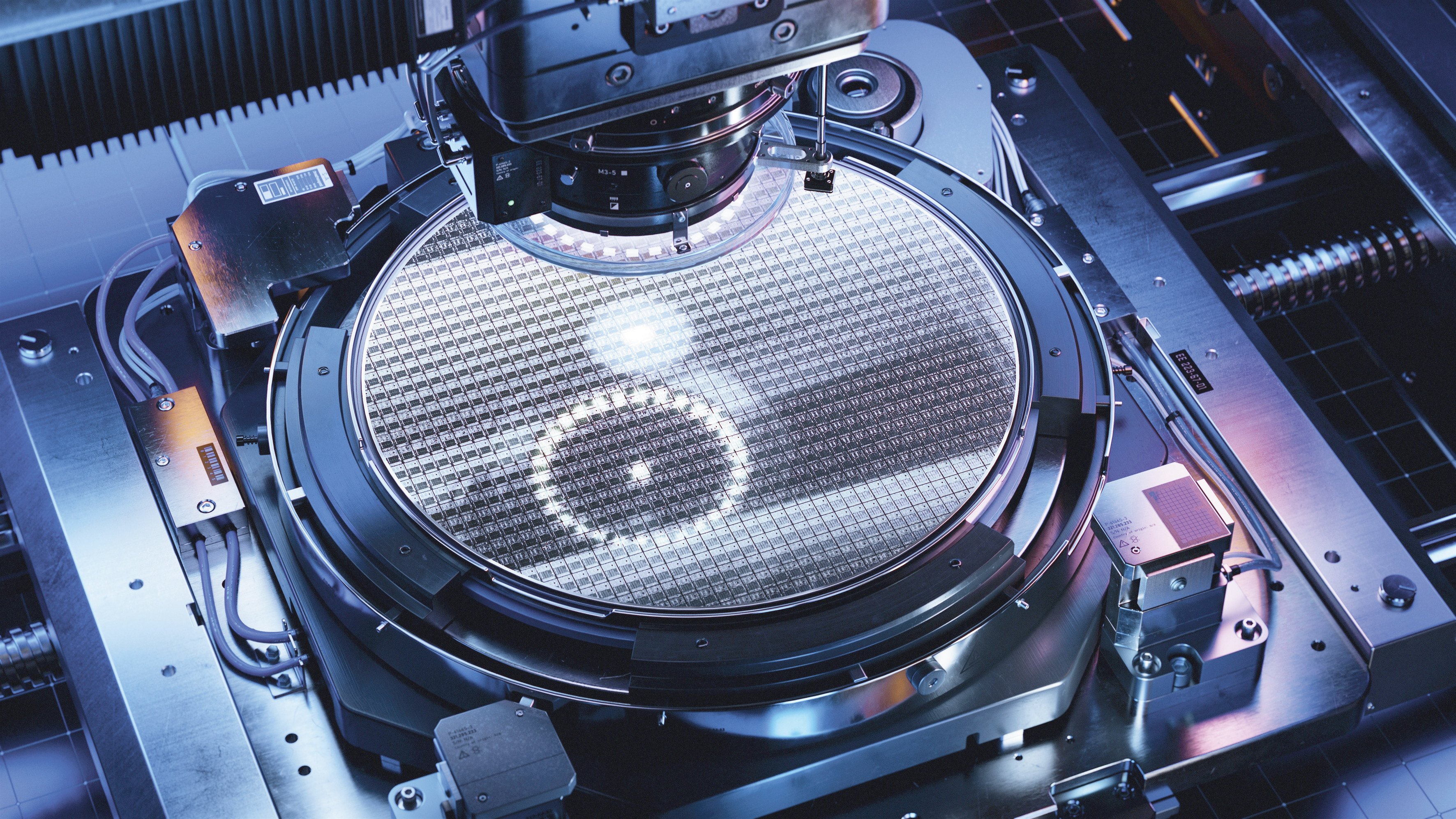 A silicon wafer during the photolithography process inside a computer chip production machine. Semiconductor manufacturing has been targeted by both the US and China with trade restrictions. Photo: Shutterstock