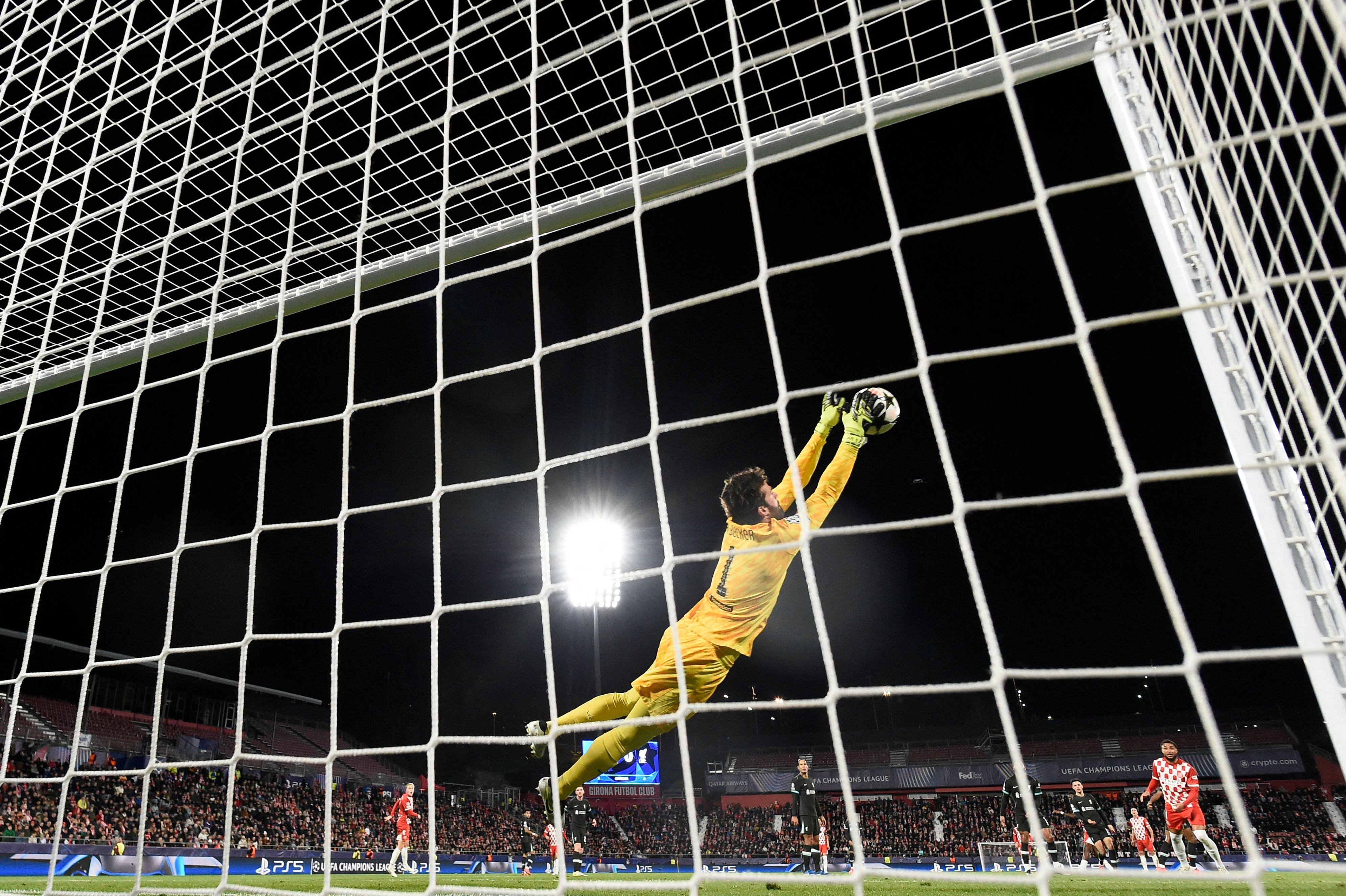 Liverpool’s Brazilian goalkeeper Alisson makes a flying save during his side’s Champions League win over Girona. Photo: AFP