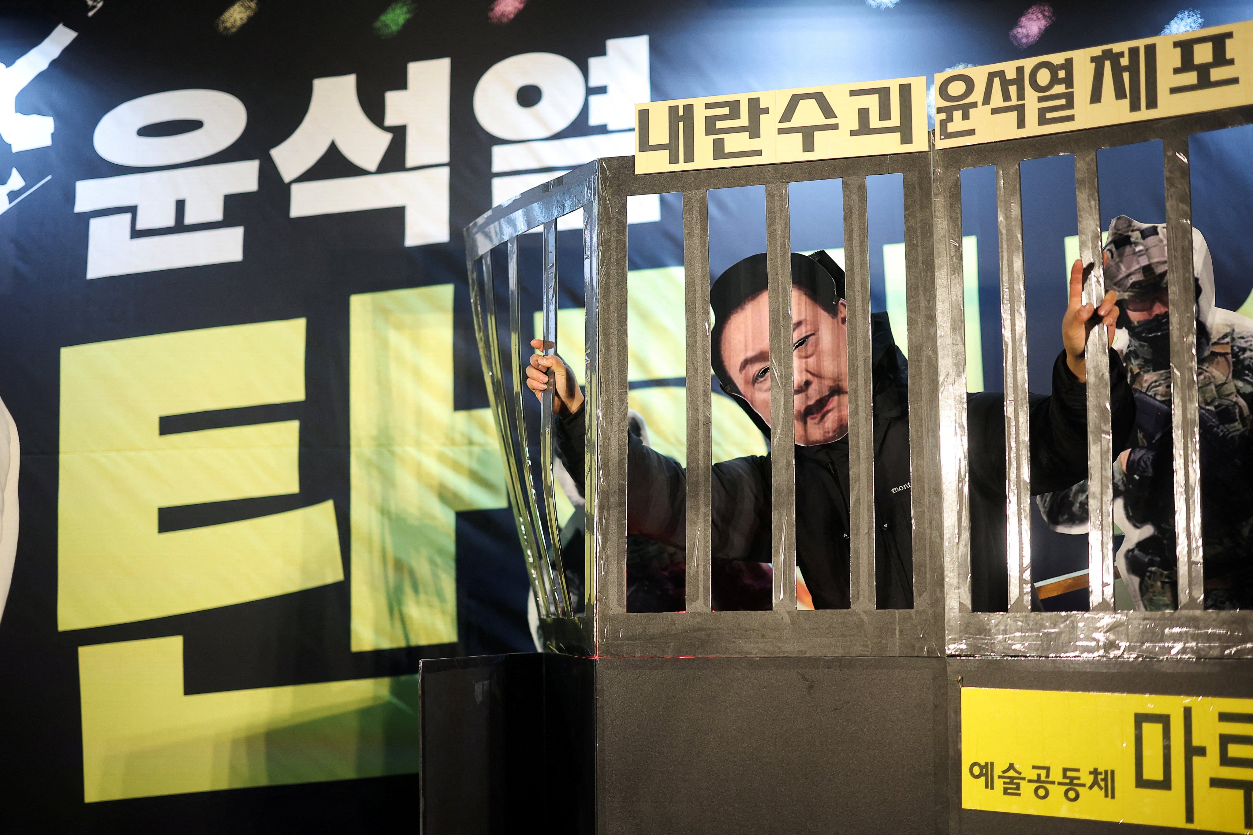 A protester wears a South Korean President Yoon Suk-yeol mask during a rally calling for Yoon’s impeachment in Seoul. Photo: Reuters