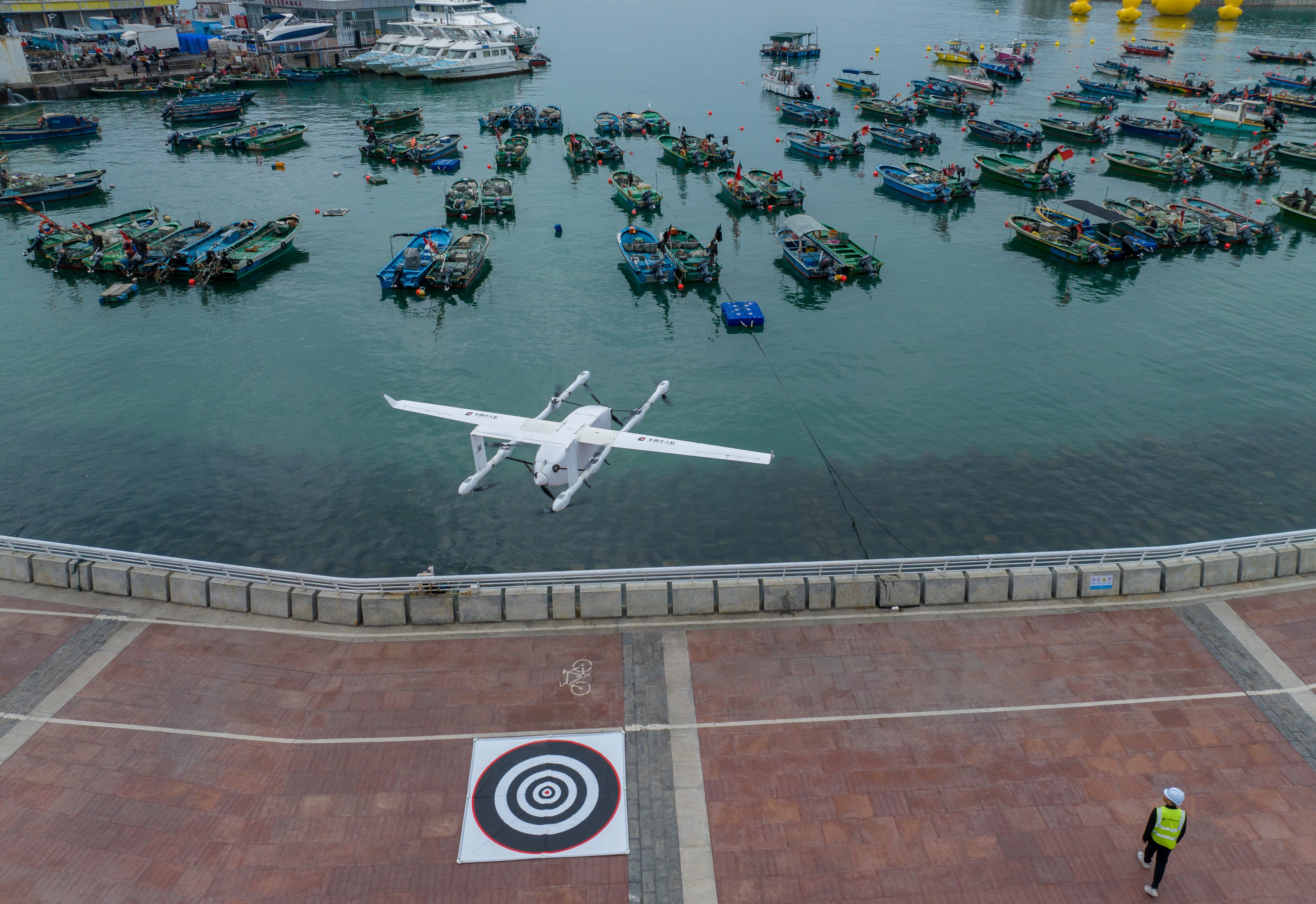 A drone delivering seafood takes off from a pier in Shenzhen on February 5. Photo: Xinhua