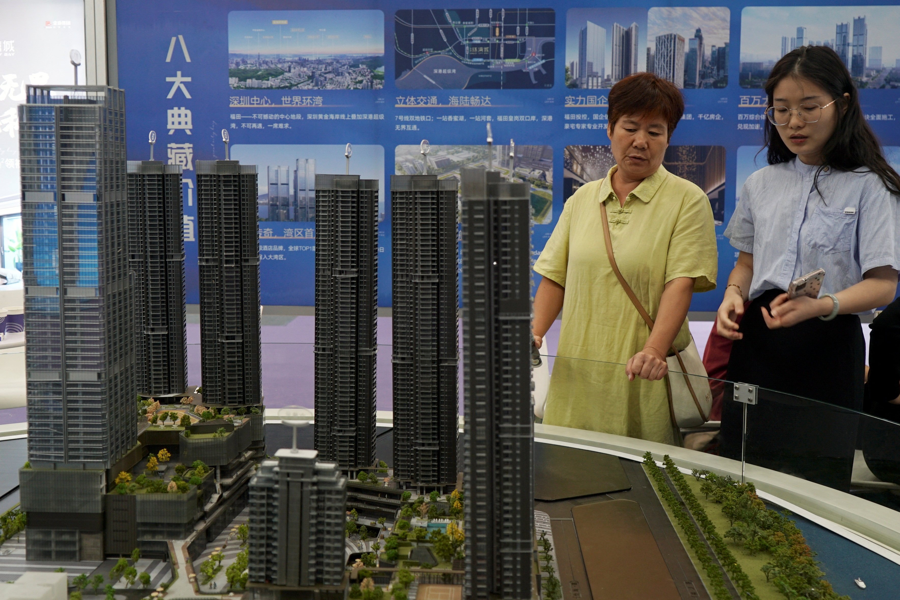 Scale models of residential buildings are displayed at a property fair in Shenzhen, where second-hand homes sales surged to a three-year high last week. Photo: Reuters