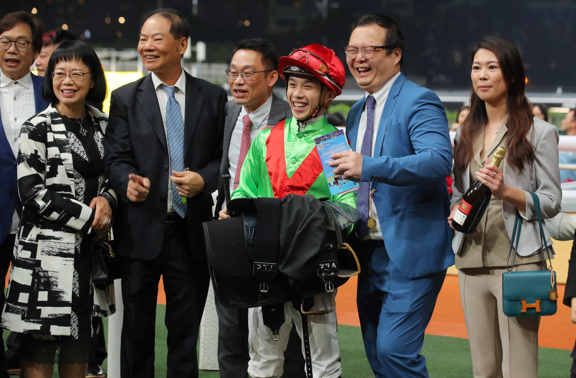 Trainer Jimmy Ting (middle) celebrates Good Luck Win’s knockout success with jockey Angus Chung and connections.