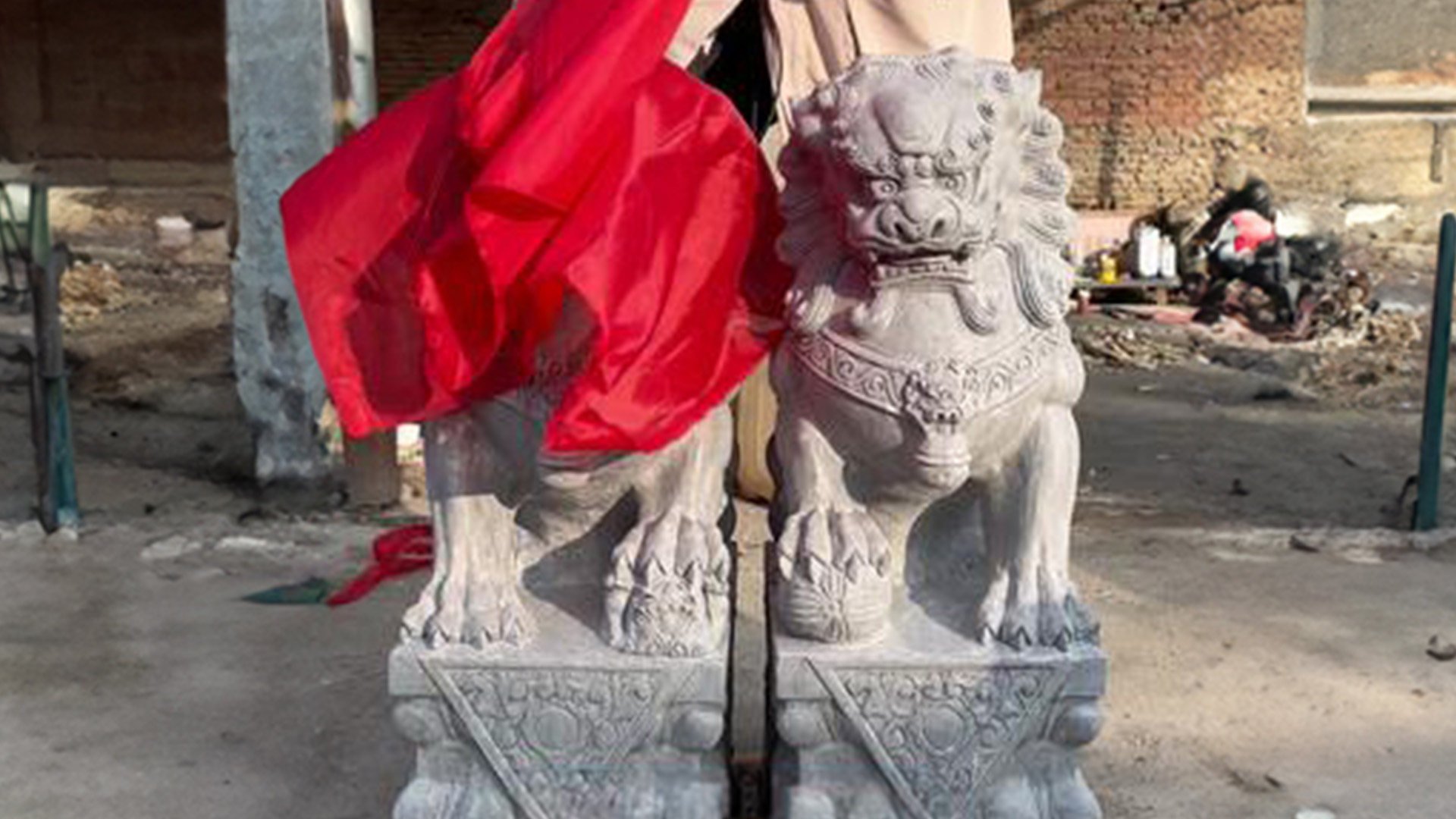 The Post explores the various reasons why stone lions in China are draped in red cloth or fabric during auspicious occasions. Photo: Douyin