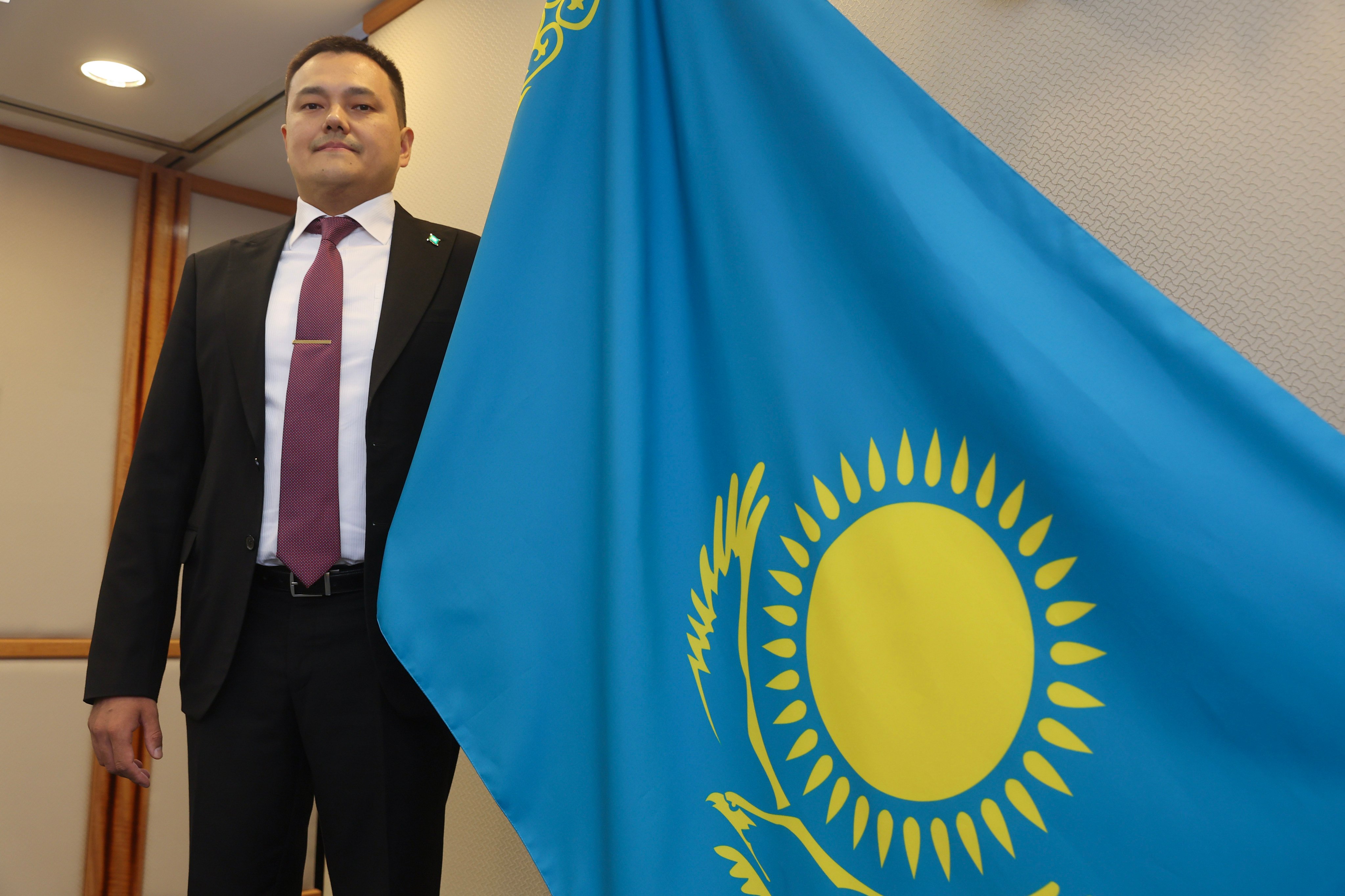 Almas Seitakynov, consul general of Kazakhstan in Hong Kong, poses with his country’s flag, in Central on October 4. Photo: Edmond So