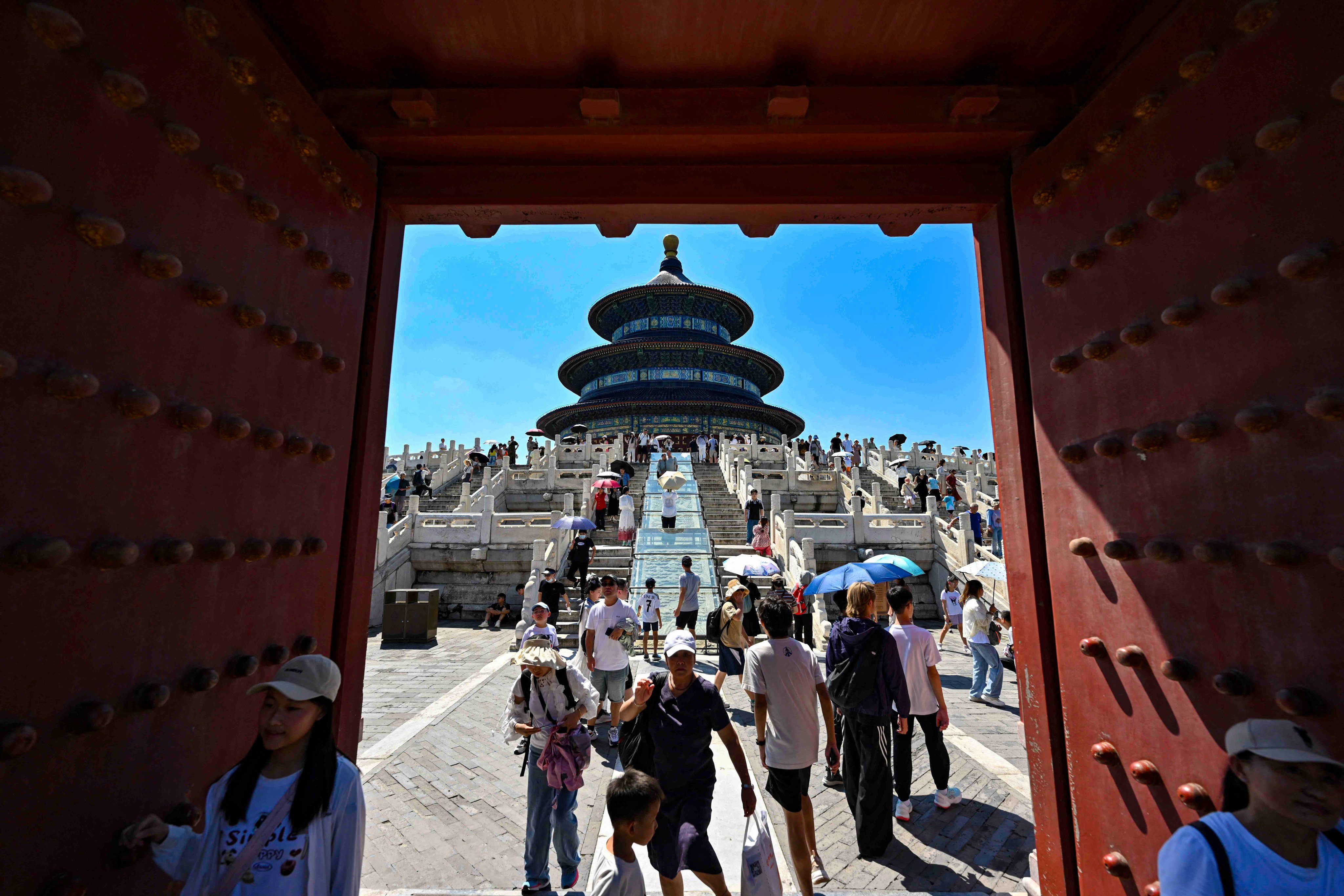 People visit the Temple of Heaven in Beijing on August 22. Photo: AFP