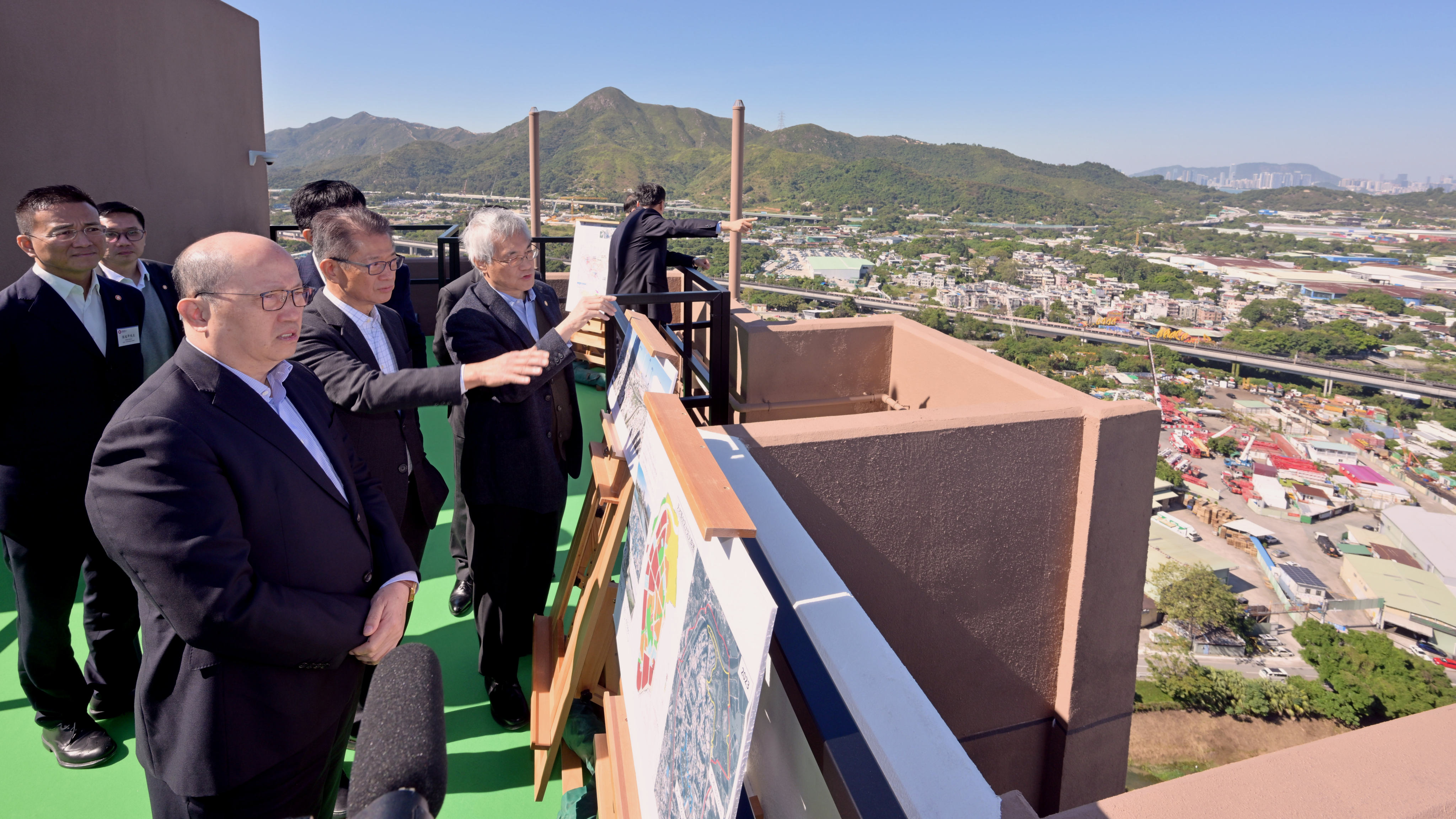 Financial Secretary Paul Chan, centre, leads a delegation during a visit to the Northern Metropolis on November 29. Photo: Handout