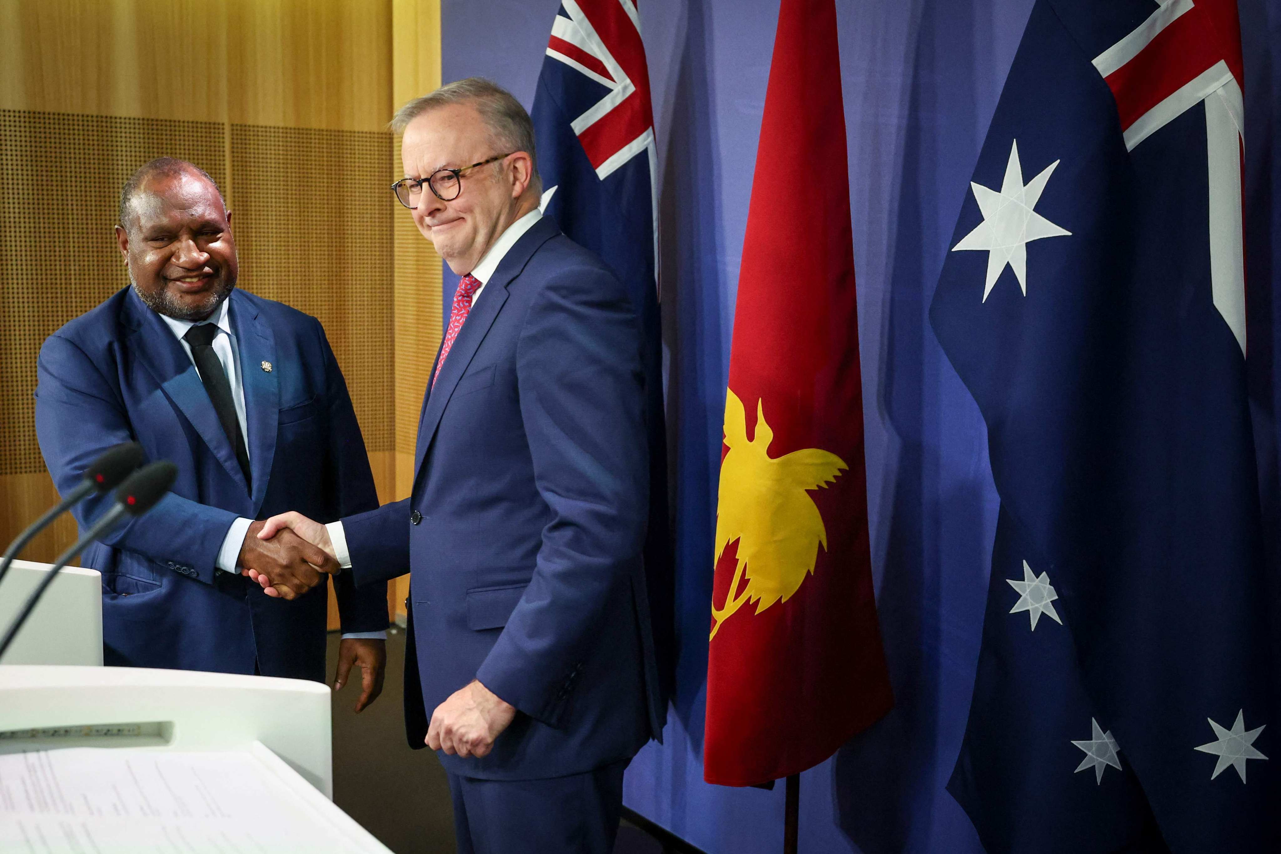 Australian Prime Minister Anthony Albanese (right) shakes hands with Papua New Guinea’s leader James Marape during a press conference in Sydney on Thursday. Photo: AFP