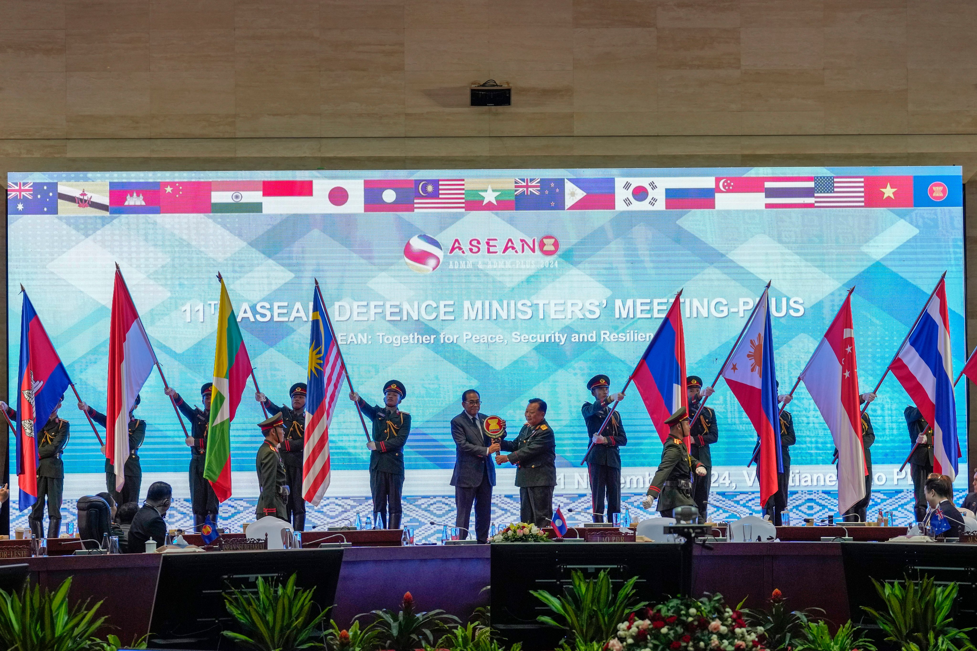 Malaysia’s Defence Minister Mohamed Khaled Nordin receives an Asean emblem at the handover of Asean chairmanship in Laos on November 21. Photo: AP