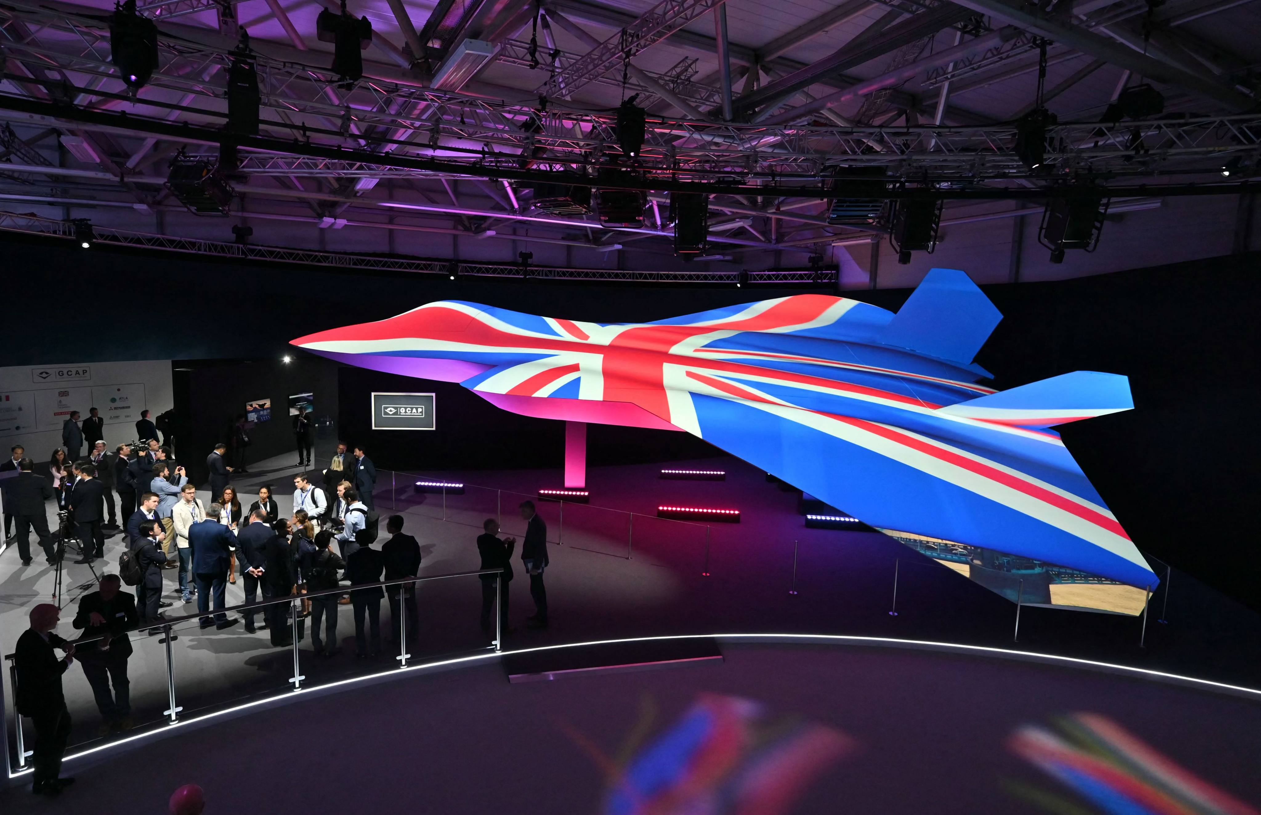 The Global Combat Air Programme’s 6th generation fighter jet concept design, bathed in the colours of the United Kingdom’s national flag, on the opening day of the Farnborough International Airshow in London on July 22. Photo: AFP