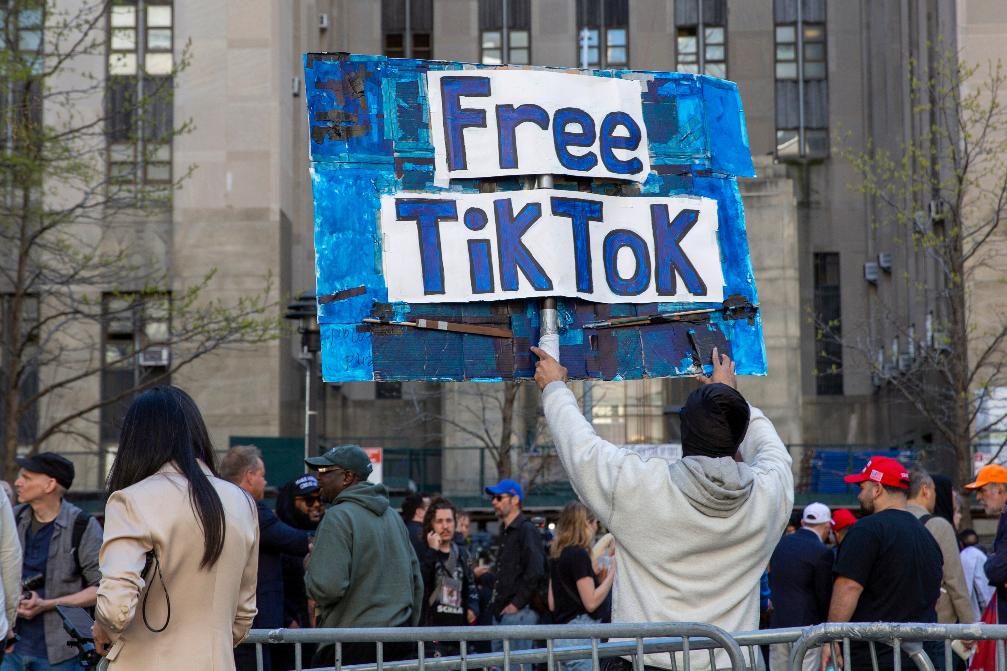 A man carries a Free TikTok sign in front of the courthouse where the hush-money trial of Donald Trump was underway on April 15 in New York. Photo: AP