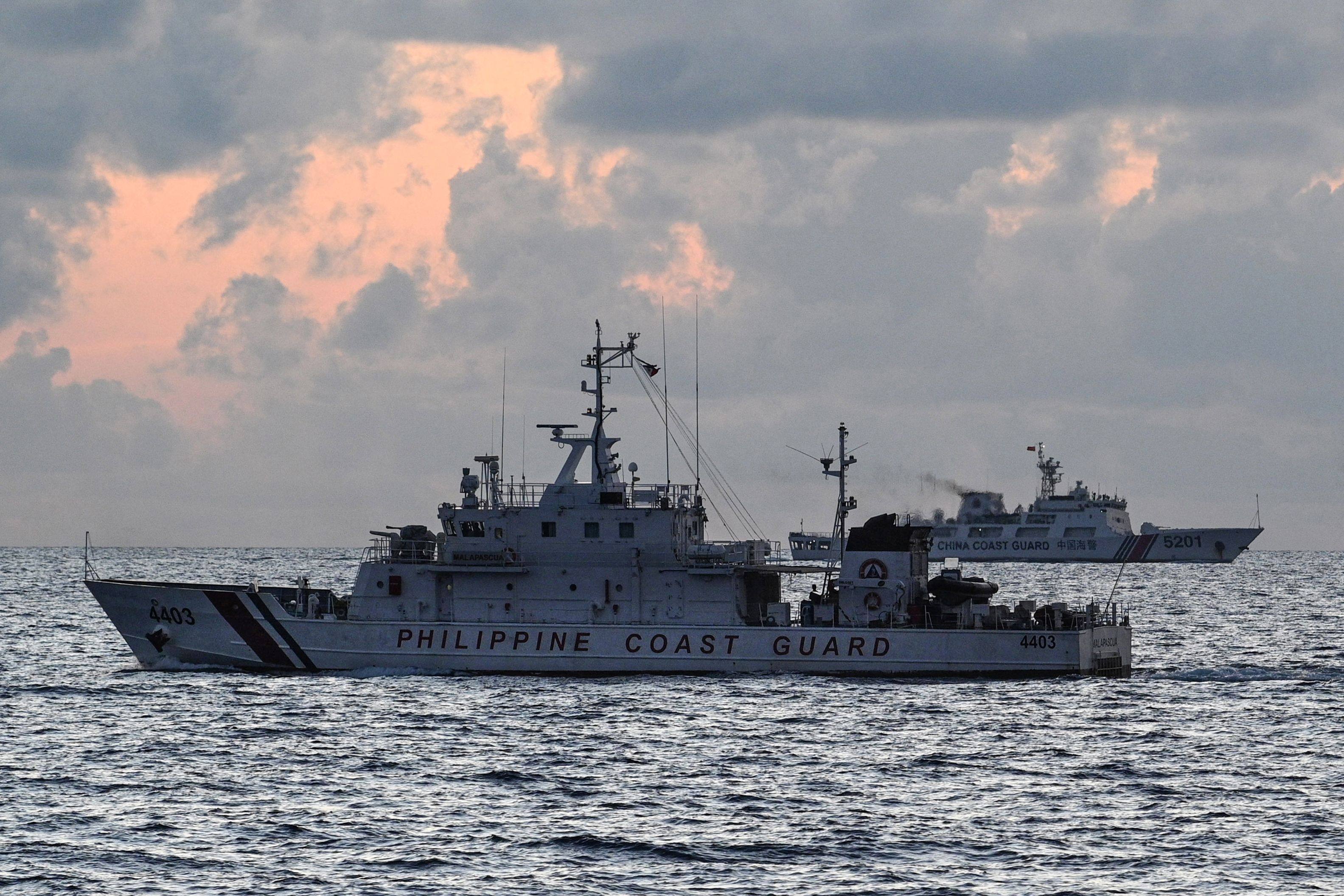 A Chinese coastguard ship shadows a Philippine vessel on patrol in the South China Sea. Photo: AFP