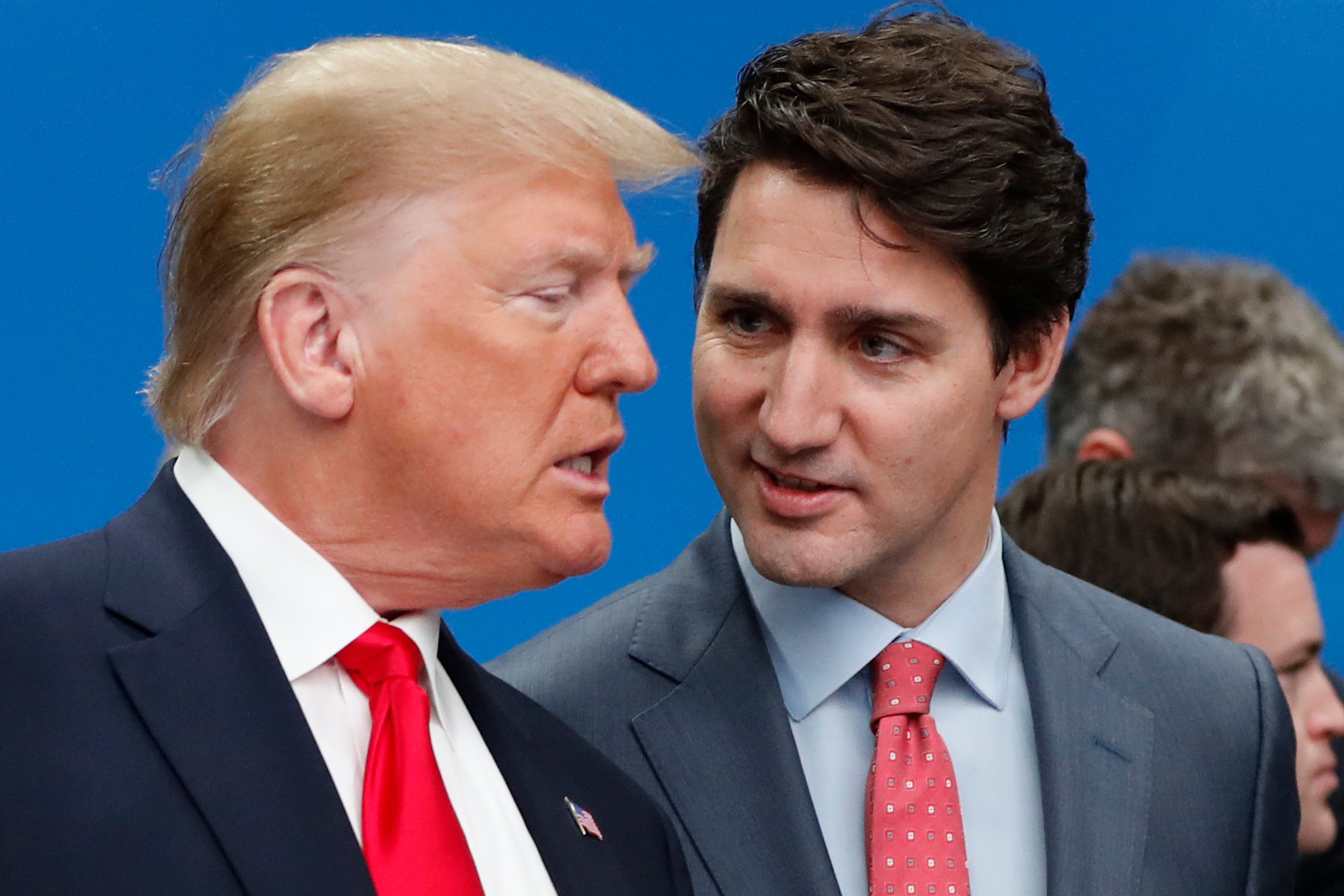 then-US President Donald Trump (left) and Canadian Prime Minister Justin Trudeau talk prior to a NATO round table meeting at The Grove hotel and resort in England, December 4, 2019. Photo: AP