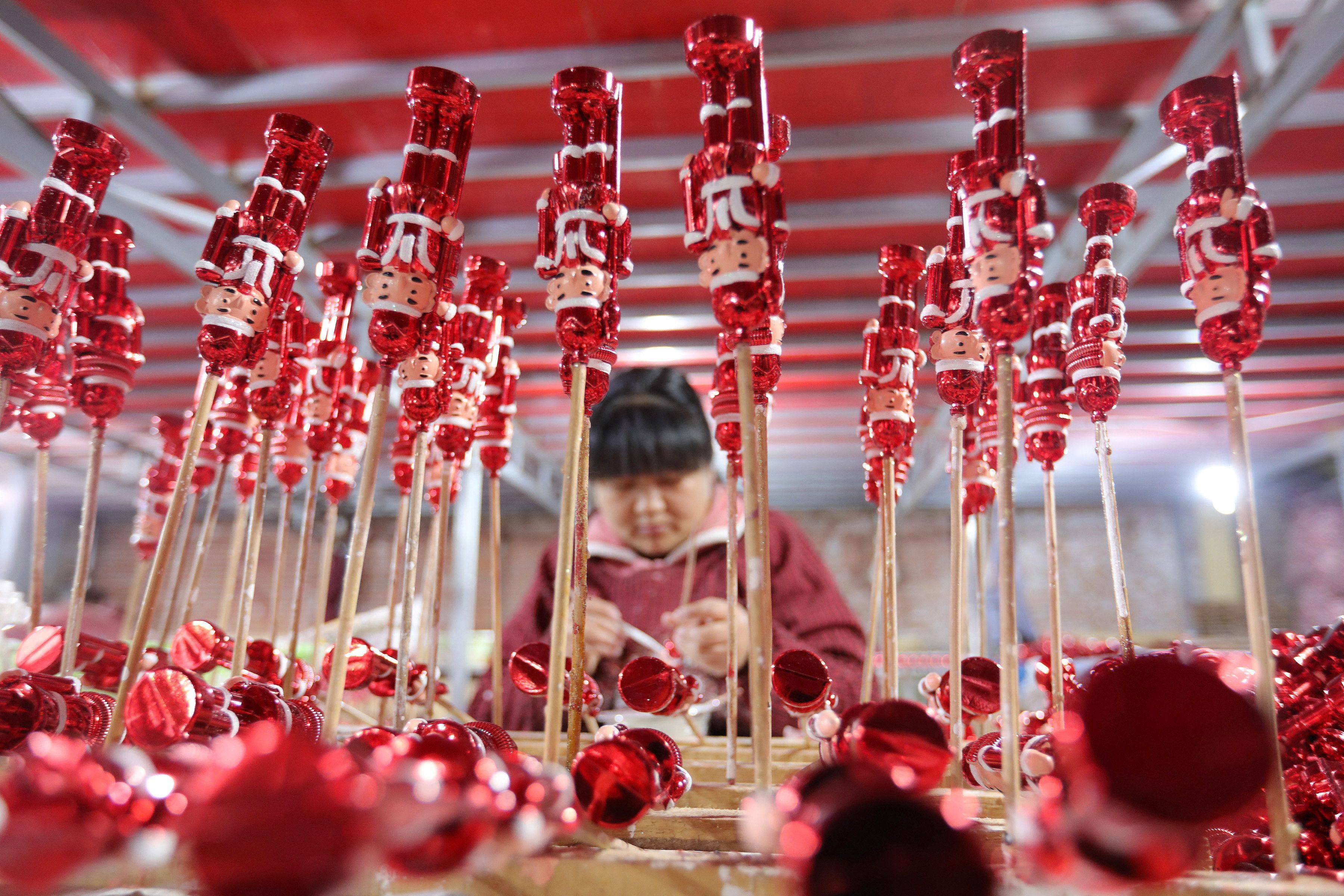 A worker making Christmas decorations in Huaibei, Anhui province. Photo: AFP