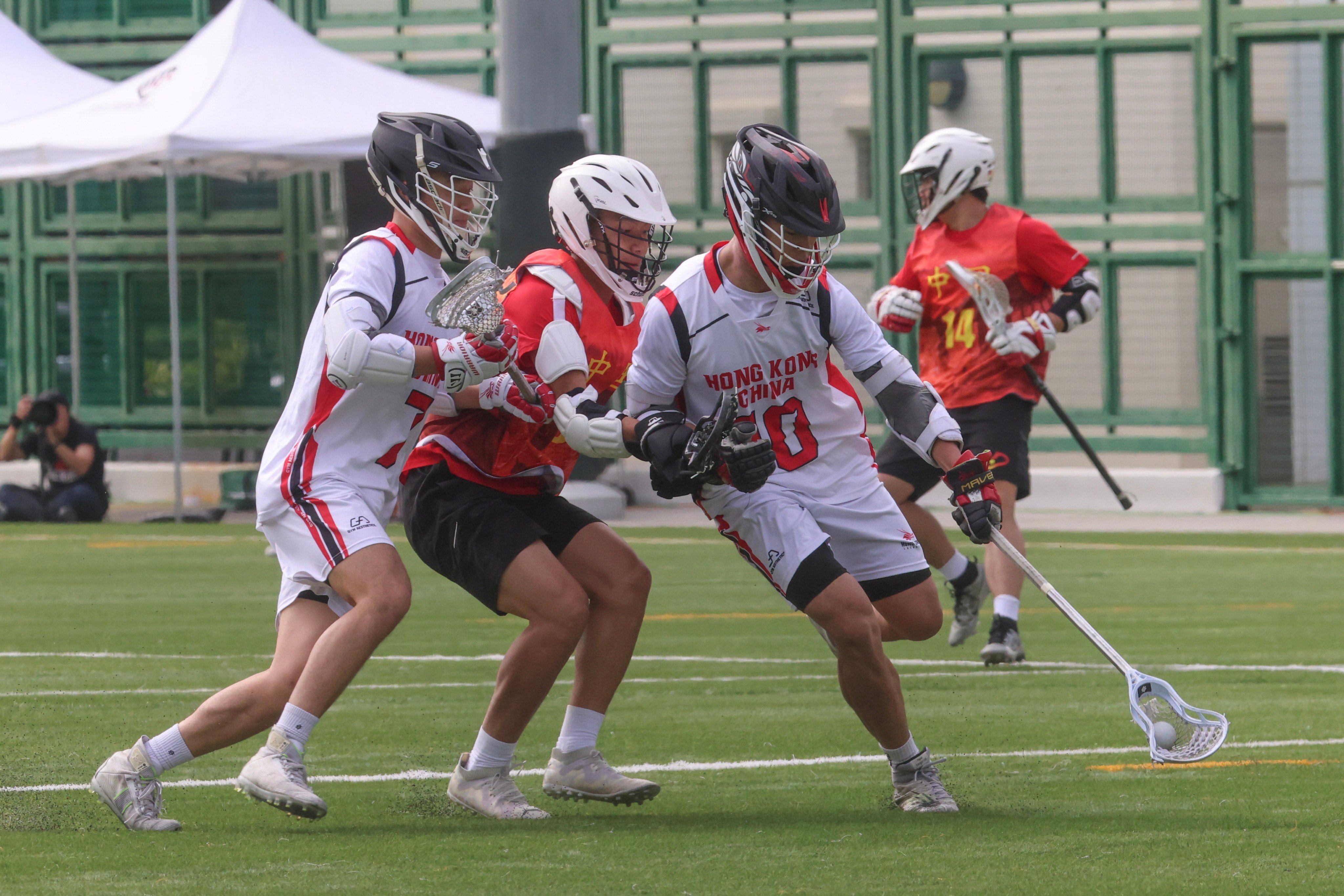 Hong Kong’s Haydn Cheung (right, in white) in action in the 20-9 win over China at the World Lacrosse Super Sixes in Aberdeen. Photo: Jelly Tse