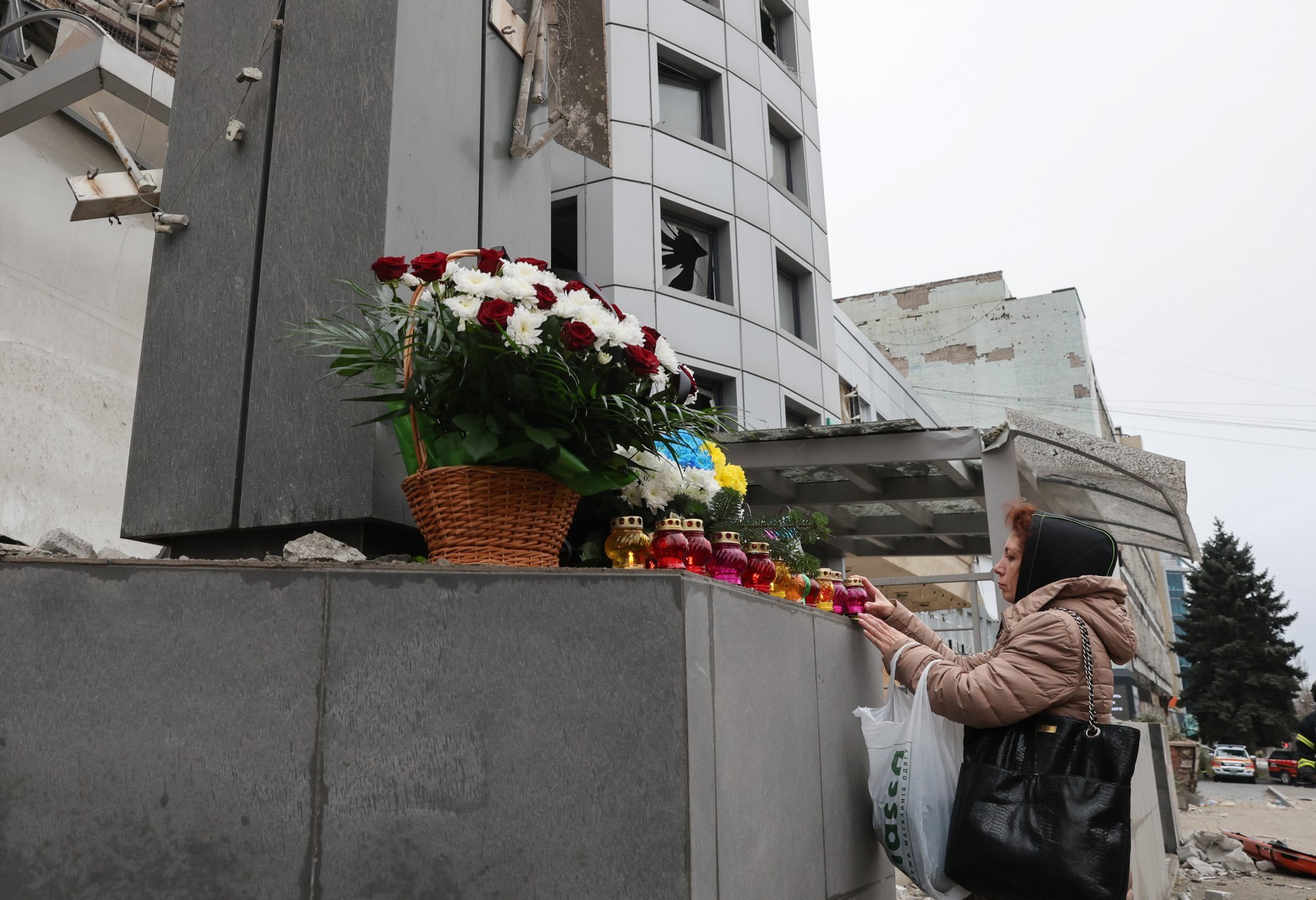 A woman visits the site of a missile strike on a medical centre in Zaporizhzhia, southeastern Ukraine, on Wednesday. At least eight people were killed and 22 others injured by the strike on December 10, 2024. Photo: EPA-EFE