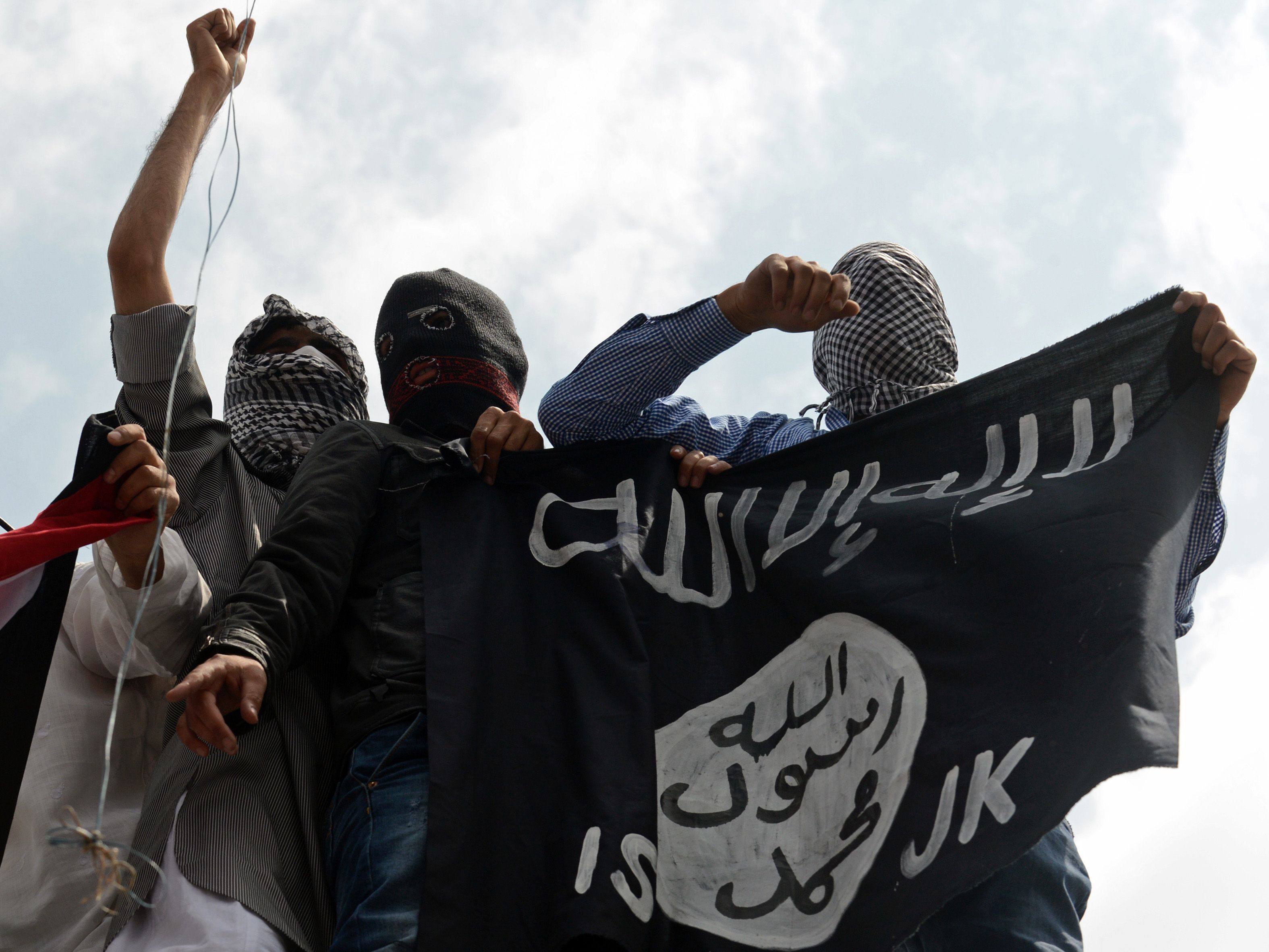 Kashmiri demonstrators hold an Islamic state flag in Srinagar, India, in 2014. Photo: AFP