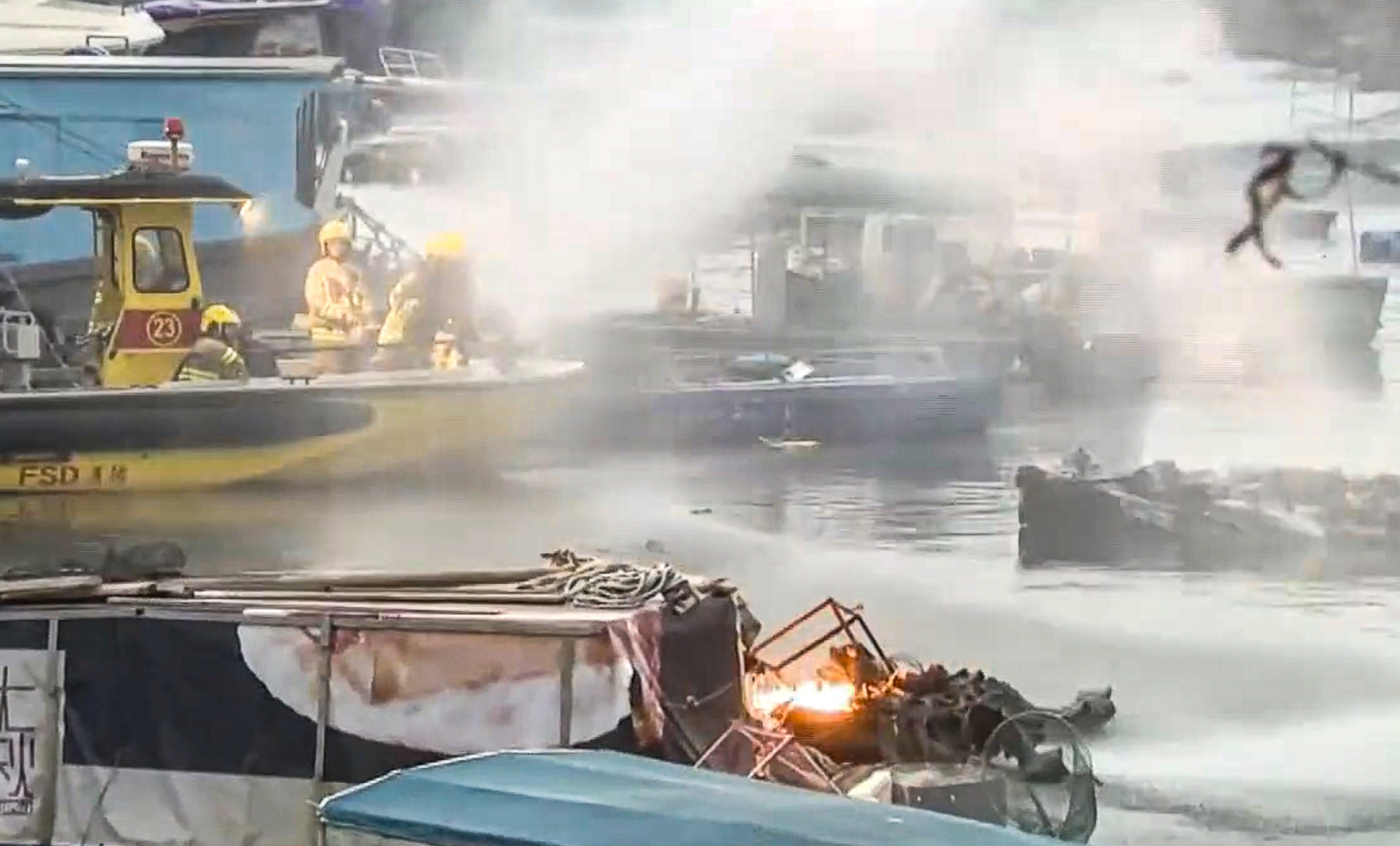 A screengrab of footage showing firefighters battling the blaze at the pier. Photo: i-Cable TV News